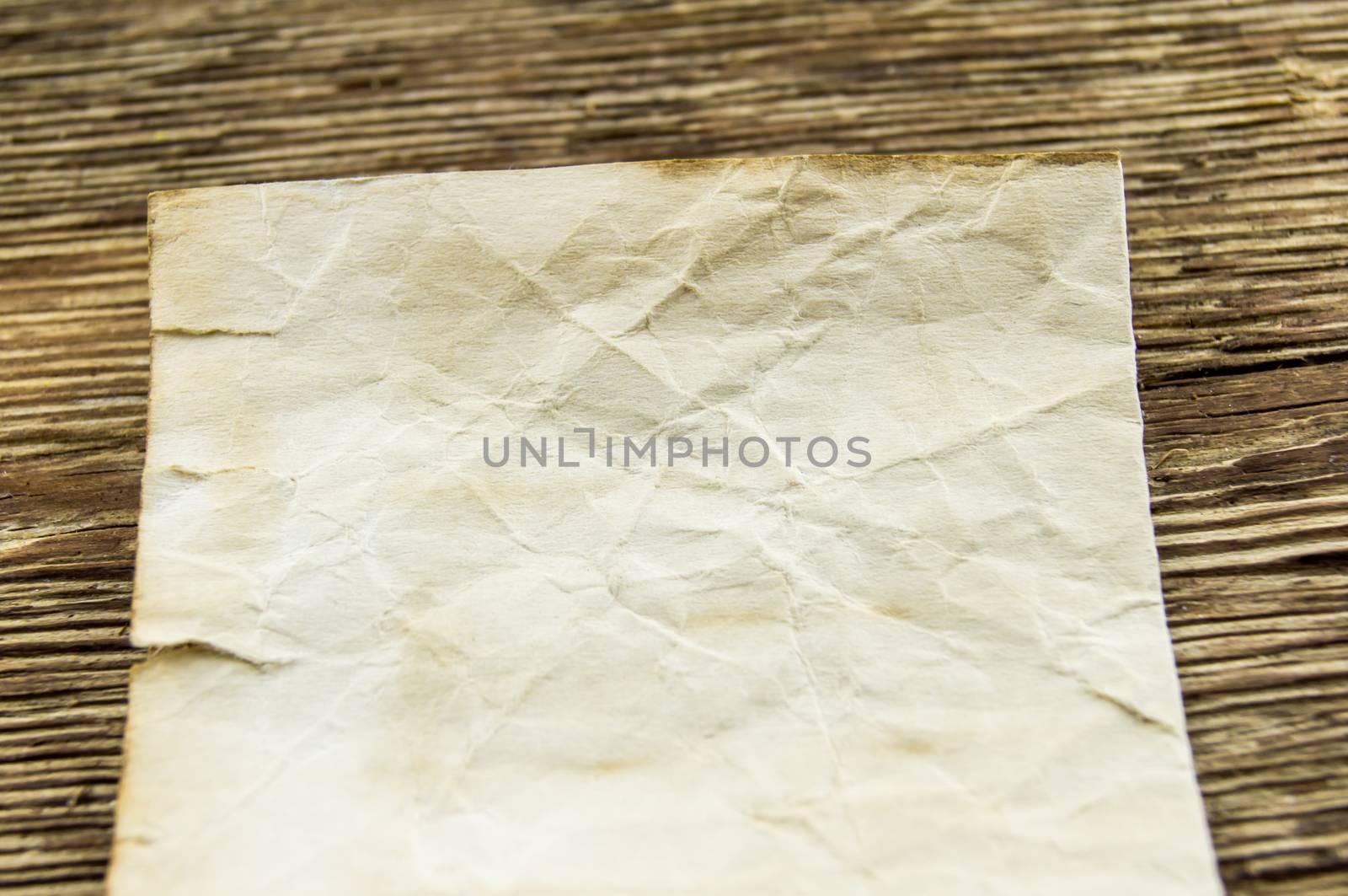 old paper  lie on a wooden background