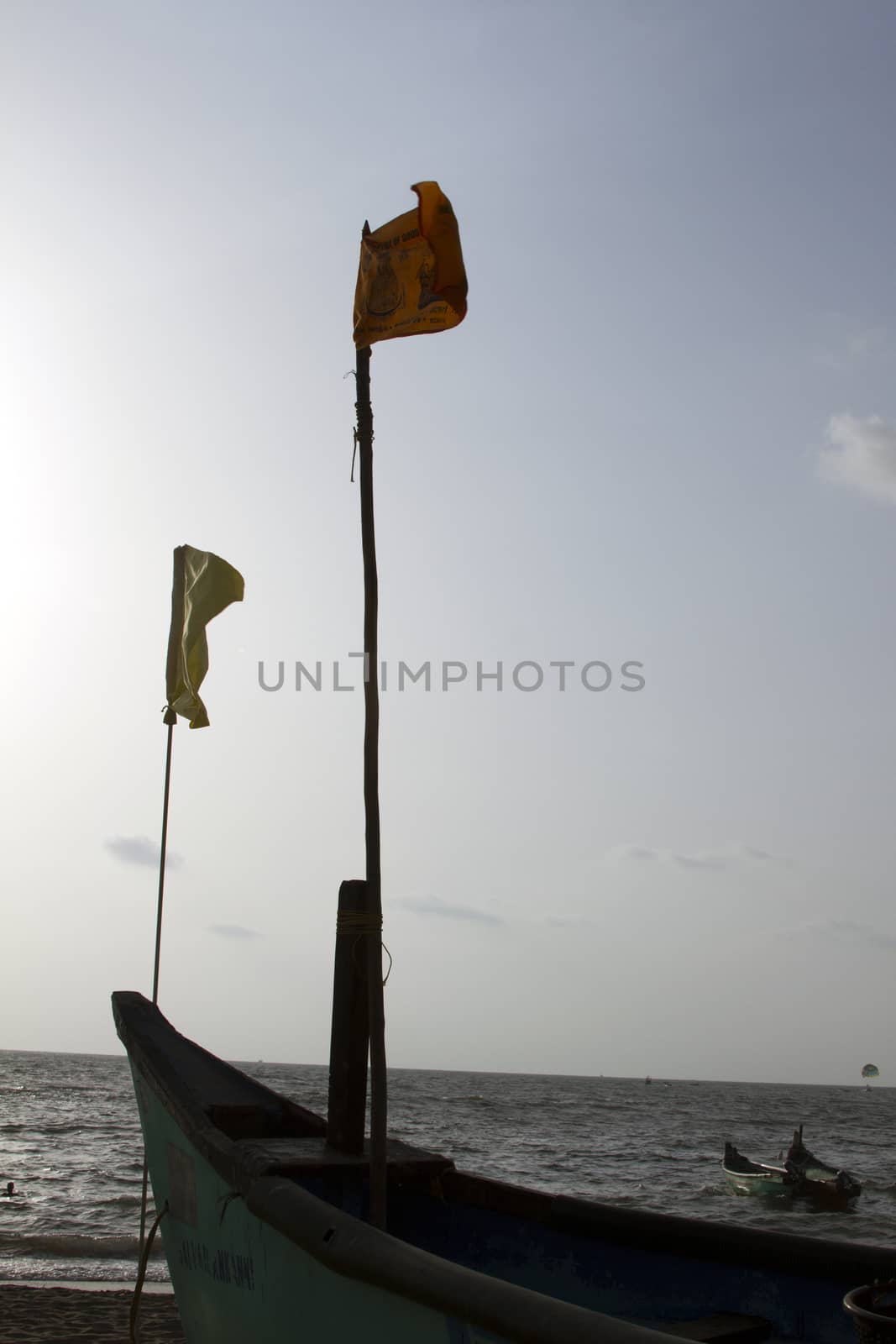 Old fishing boat standing on the sandy beach. India, Goa by mcherevan