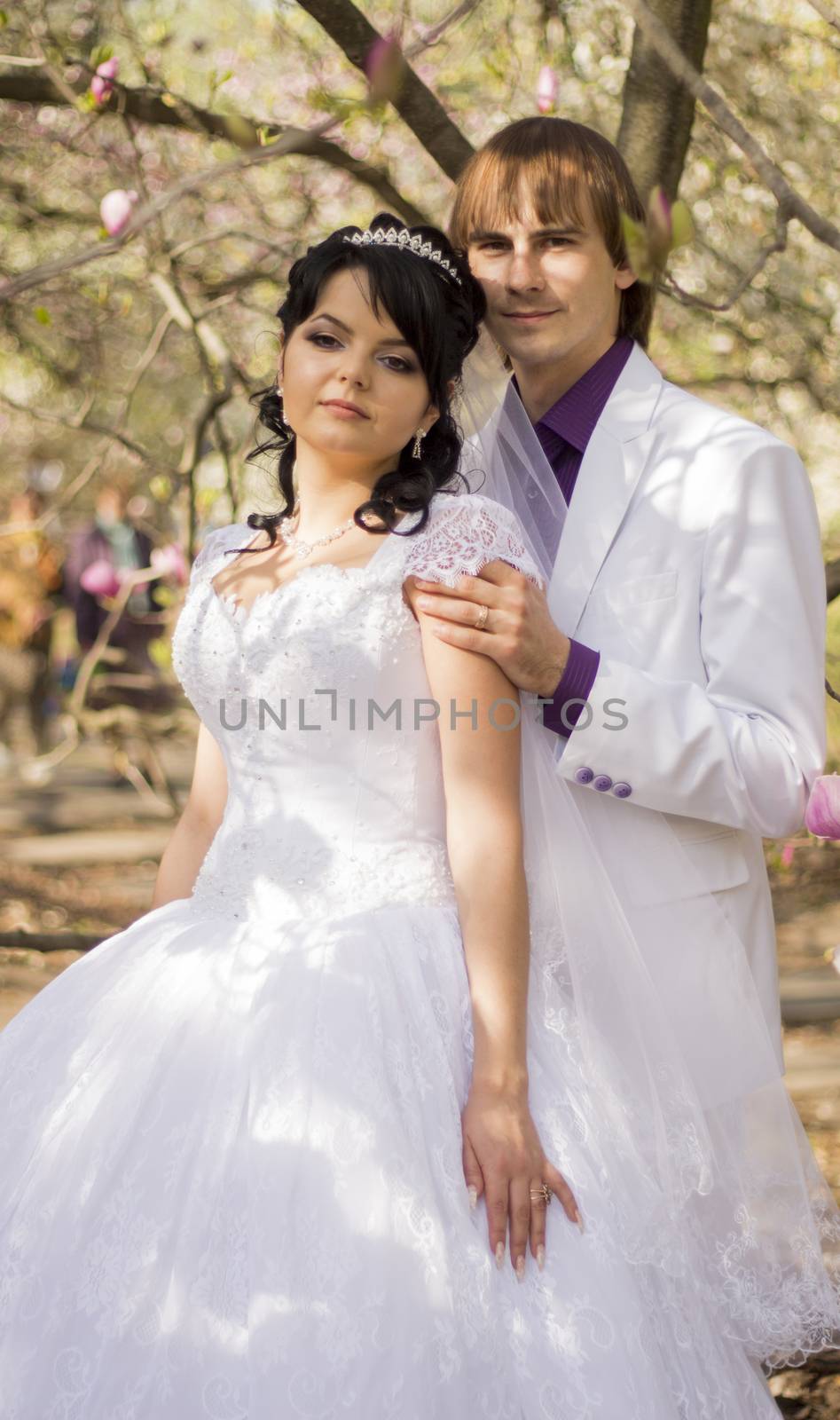 Happy young bride and groom on their wedding day.