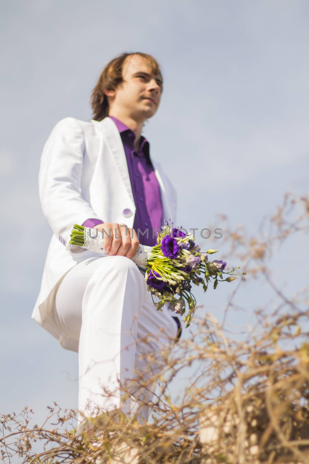man husband , groom whith beautiful wedding bouquet  by serhii_lohvyniuk