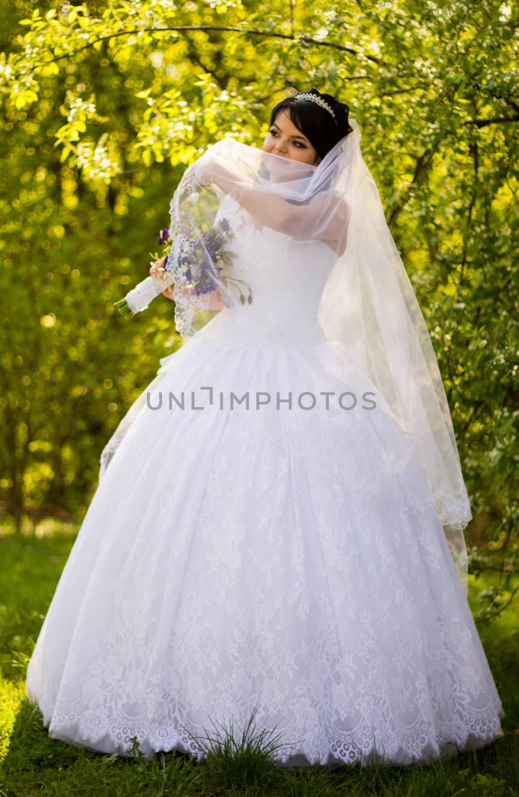 Beautiful bride posing in her wedding day by serhii_lohvyniuk