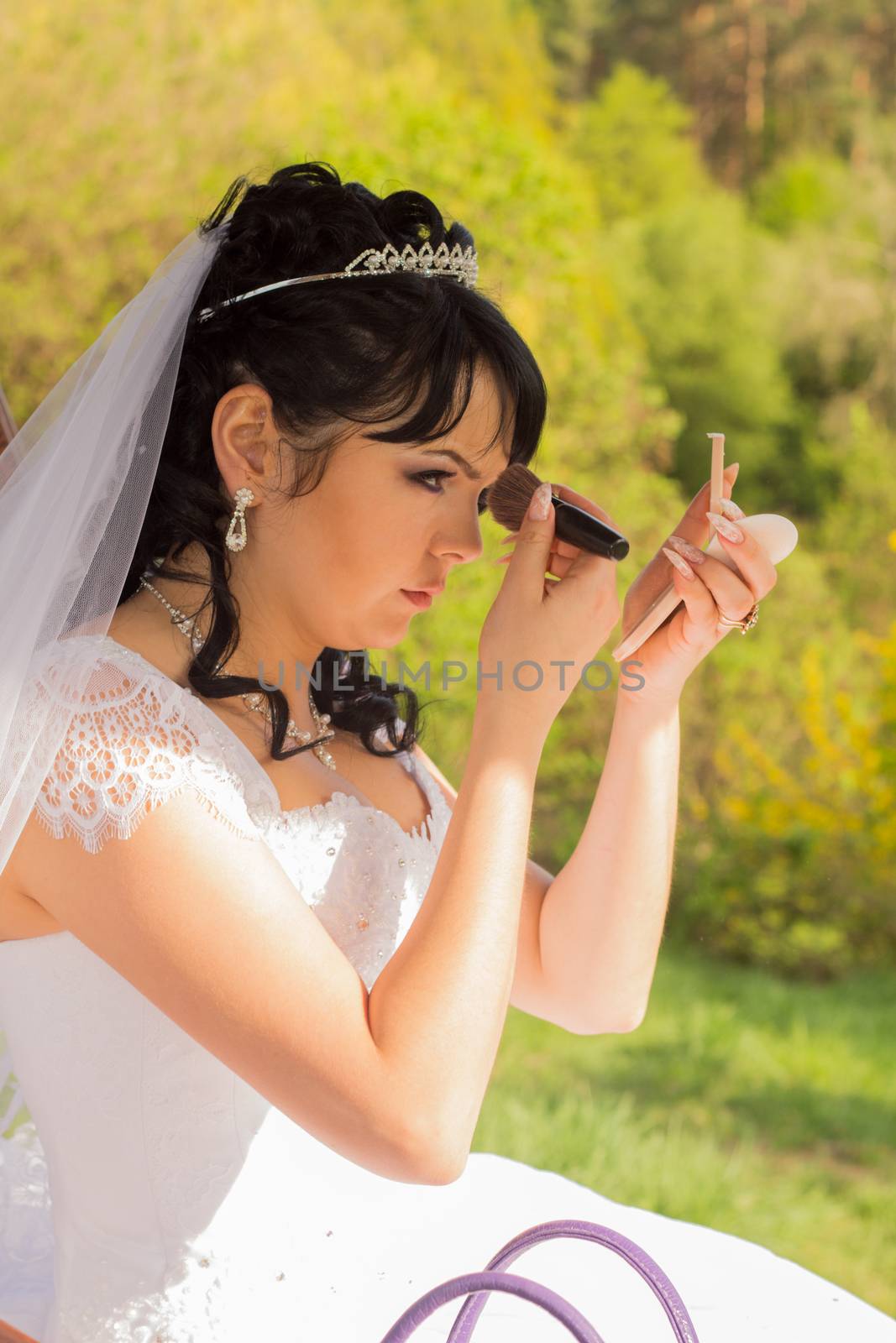 young bride is doing makeup by serhii_lohvyniuk