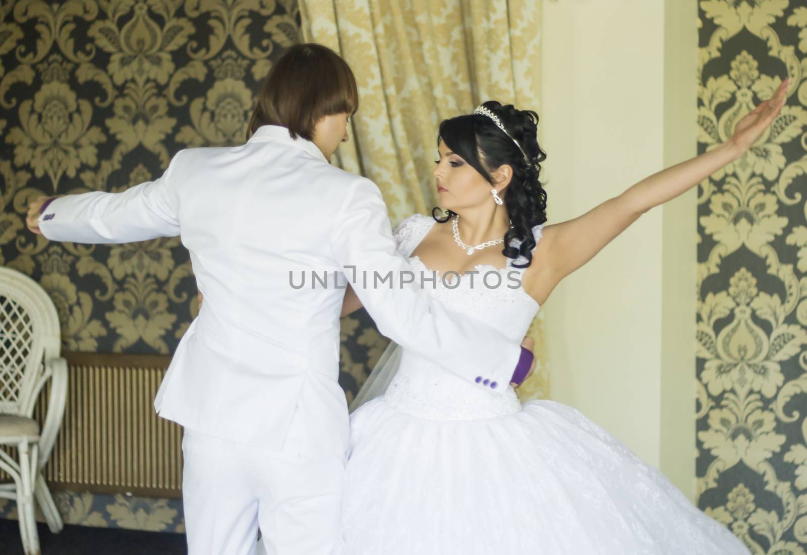 Bride groom dancing the first dance at their wedding day. For your commercial and editorial use. by serhii_lohvyniuk