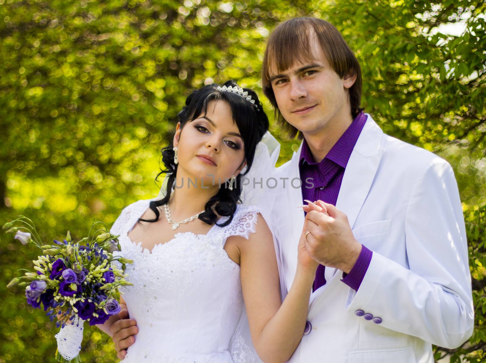 Happy bride and groom on their wedding by serhii_lohvyniuk