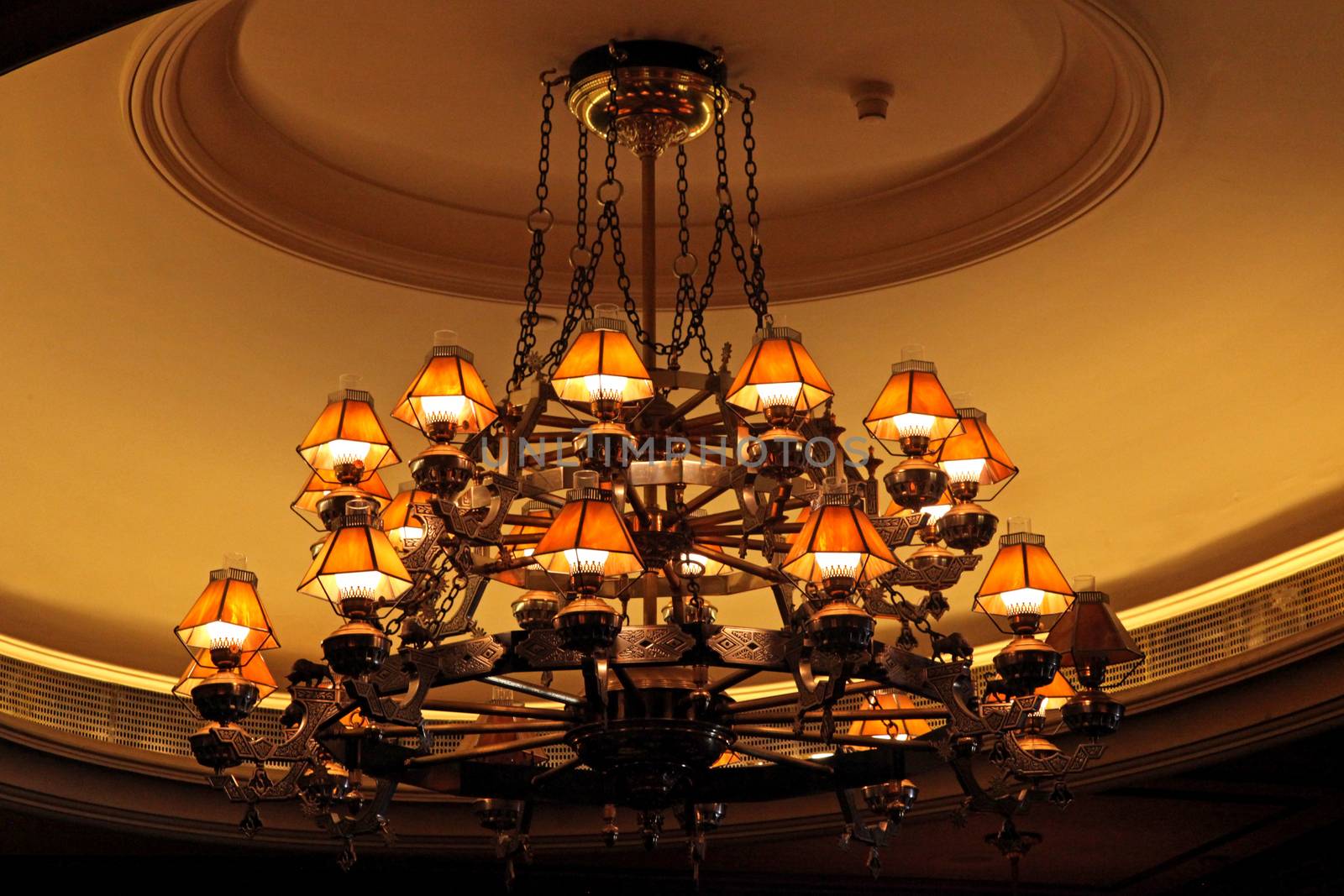 A large vintage light hanging from the ceiling