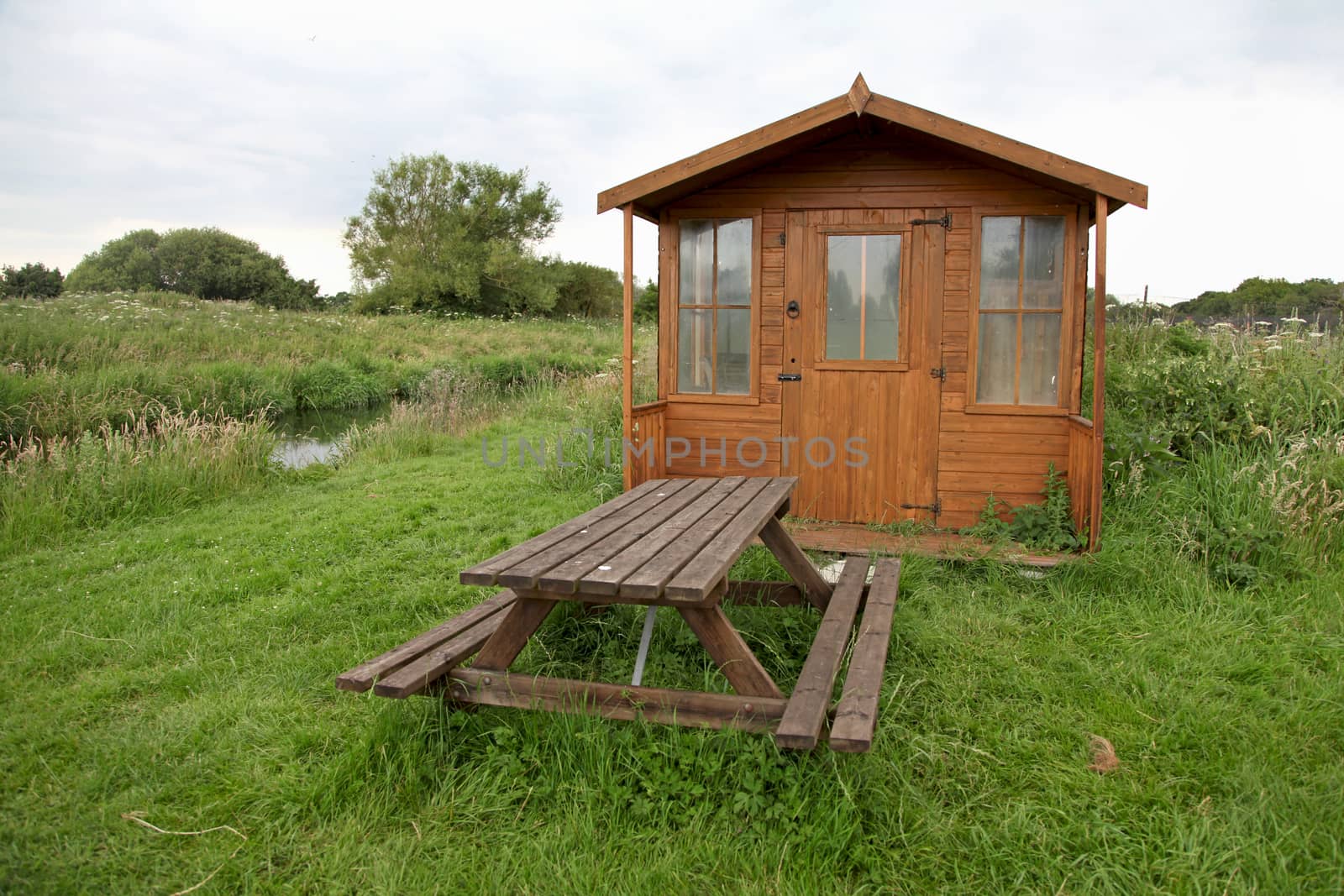 A shed and picnic table in the countryside