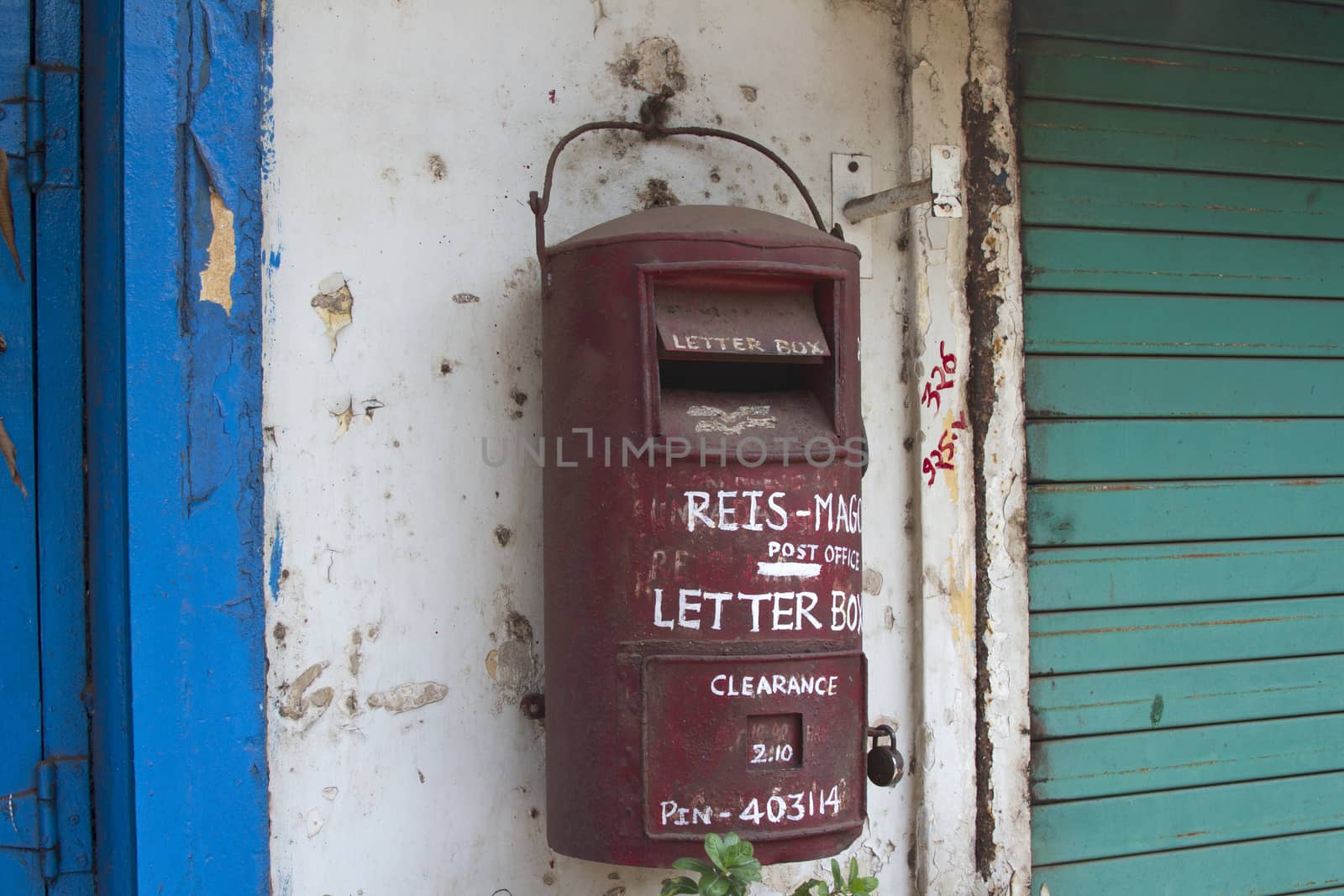 Traditional red old Indian mailbox. India Goa.