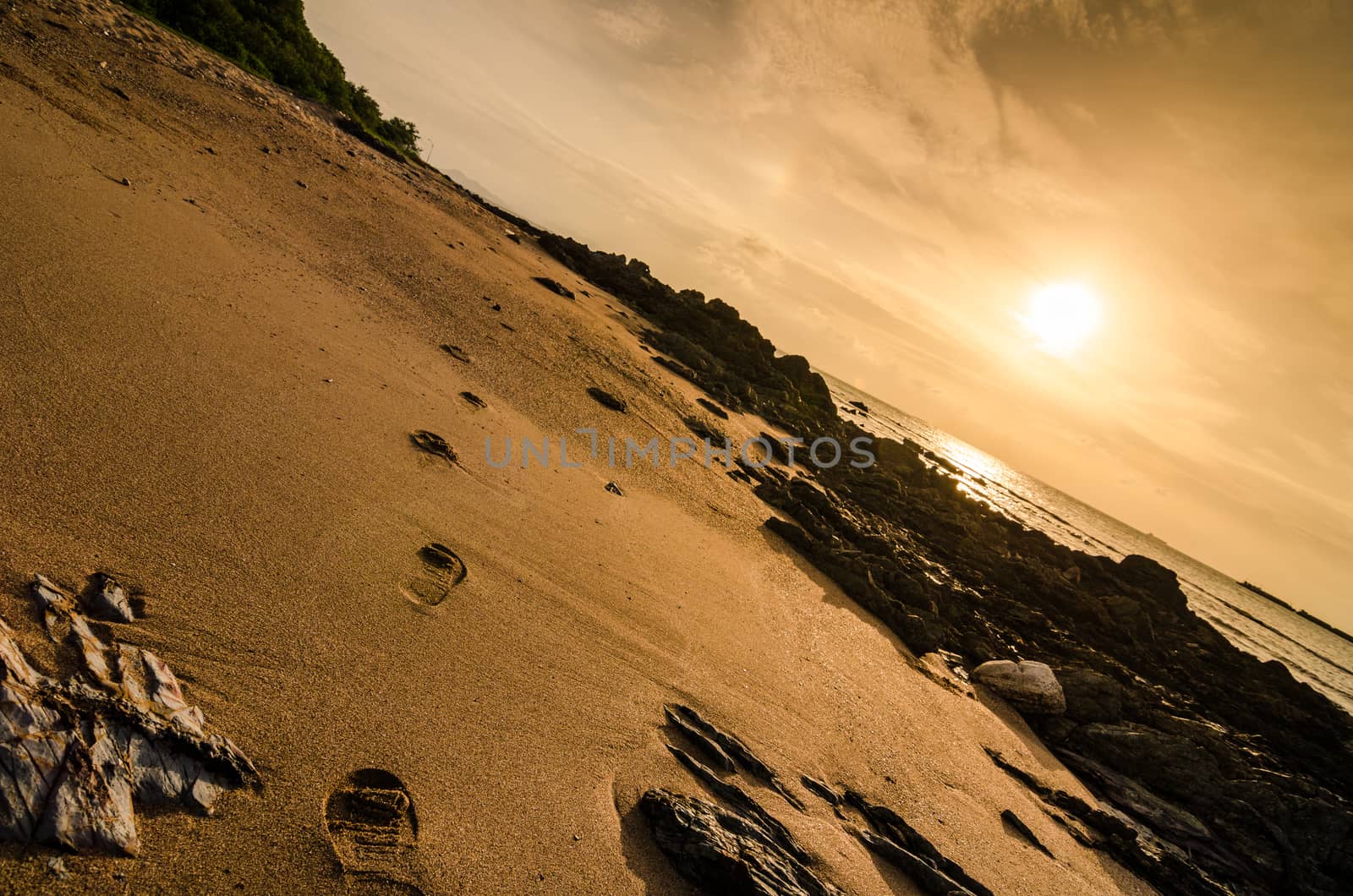 footprints and sea morning  light in Thailand