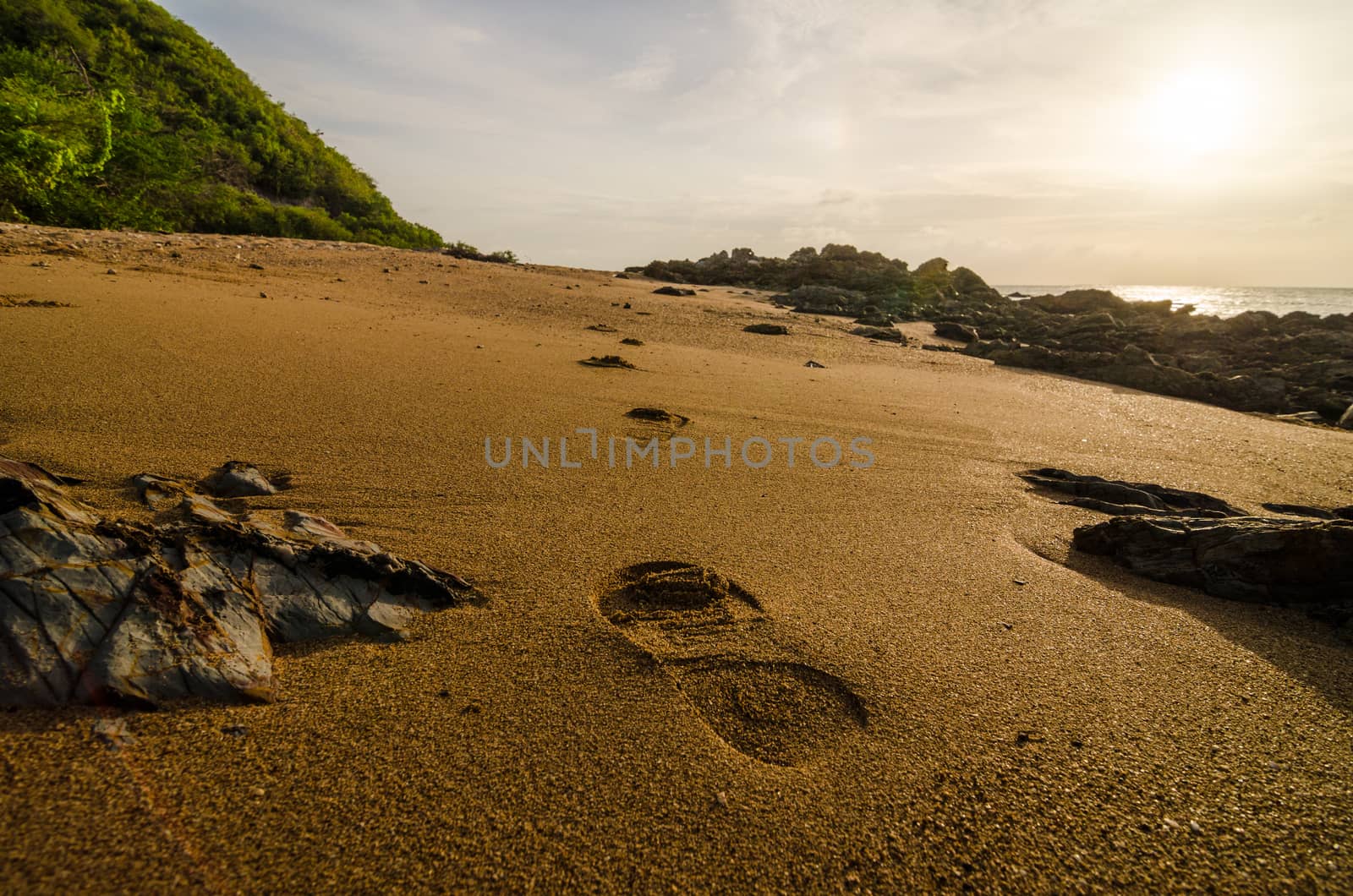 footprints and sea morning  light in Thailand