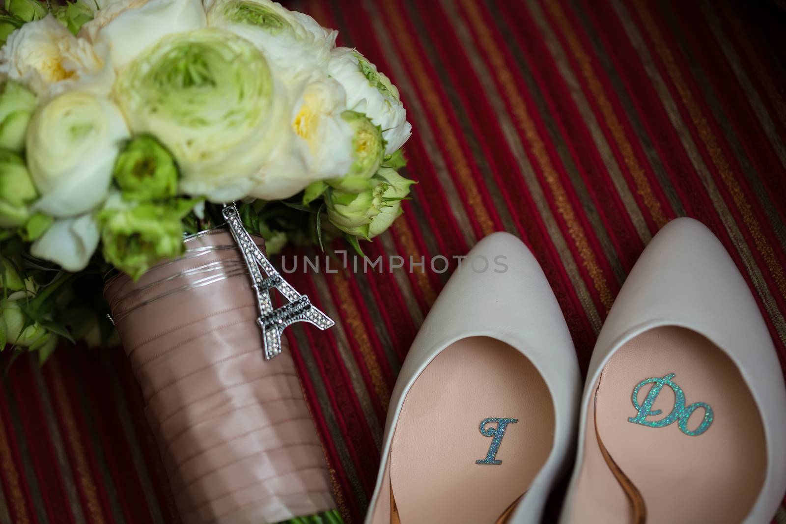 wedding shoes and wedding bouquet of white roses