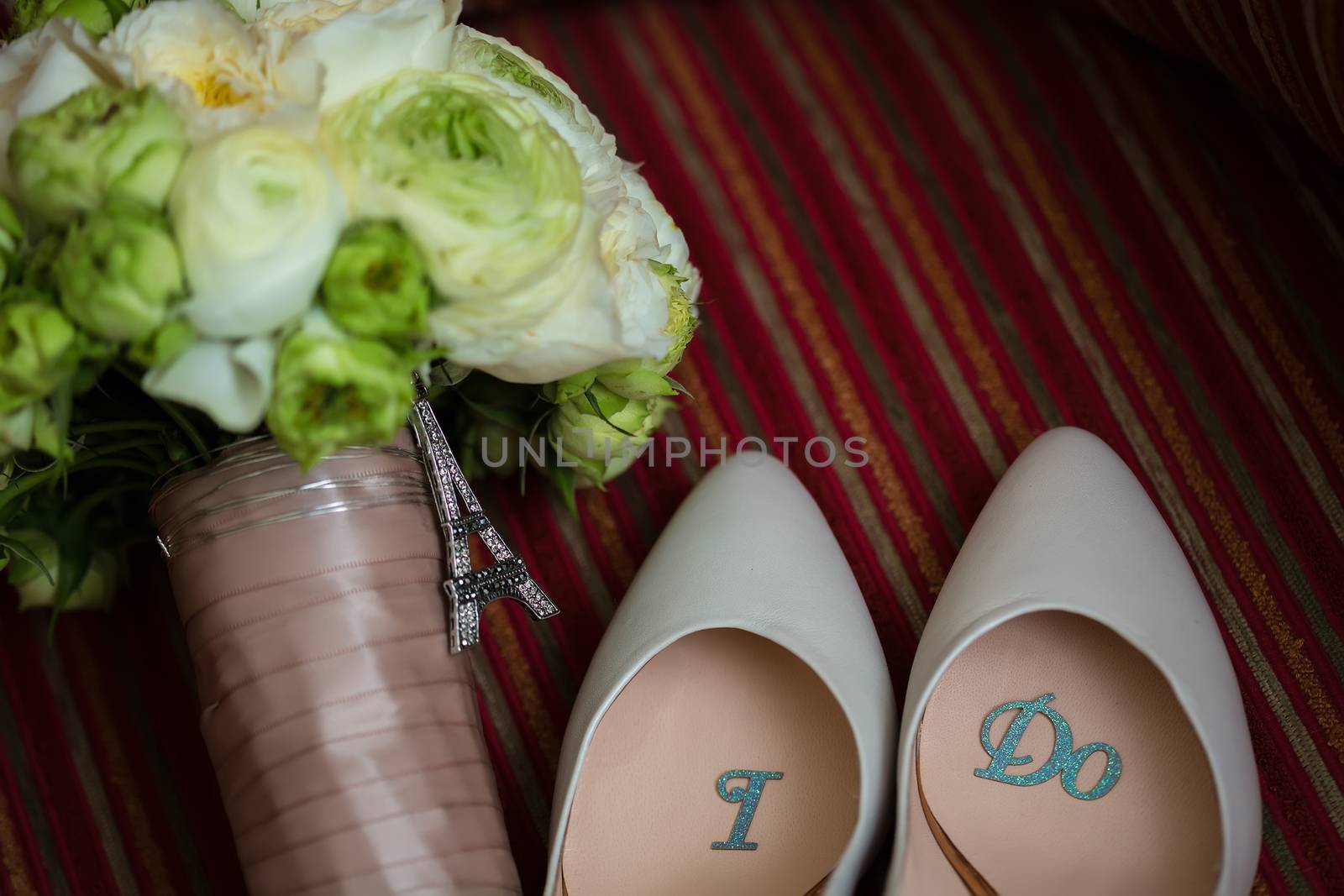 wedding shoes and wedding bouquet of white roses