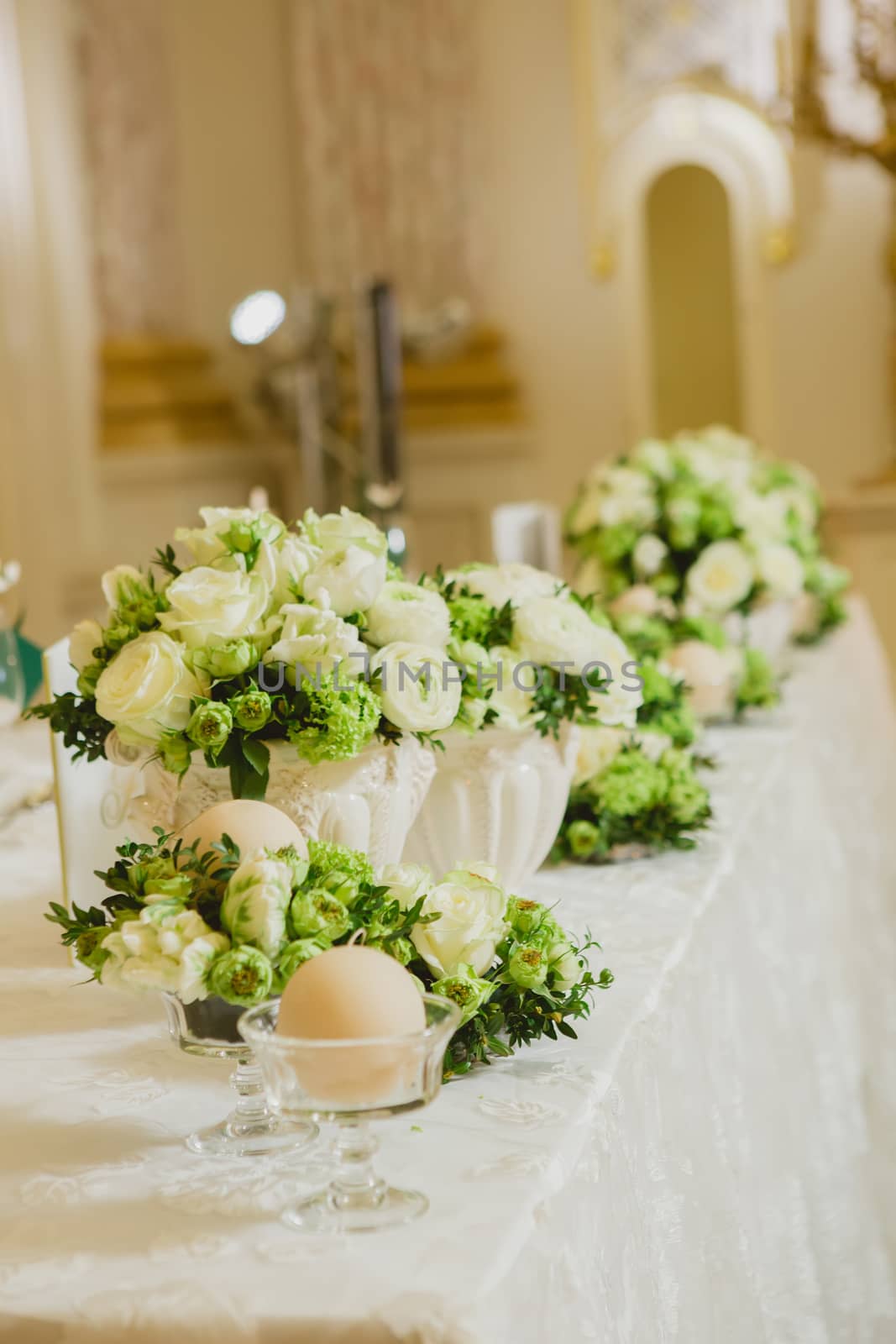 Wedding table decoration, wedding setting, wedding flowers on table, shallow depth of field.