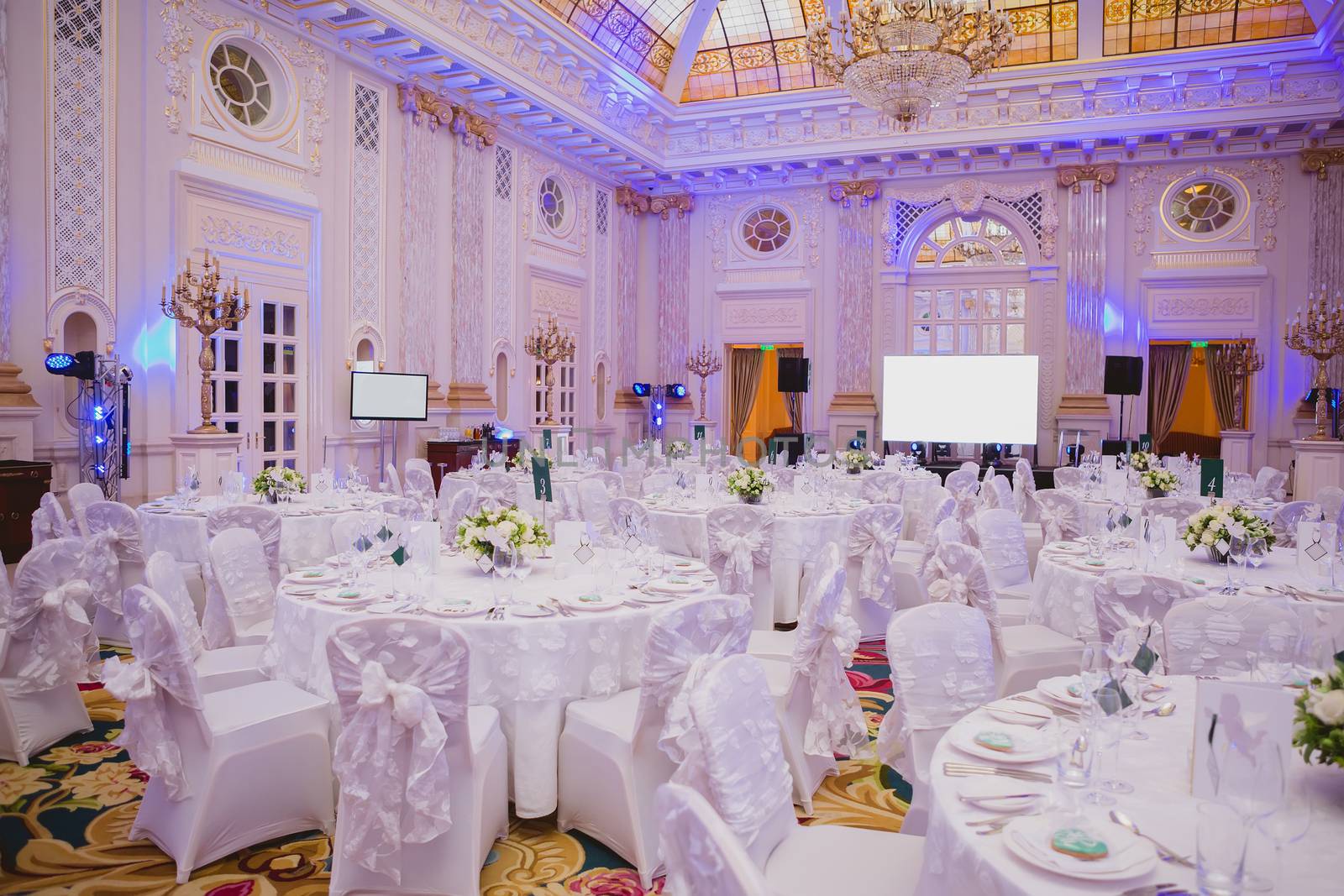 image of tables setting at wedding hall by sarymsakov