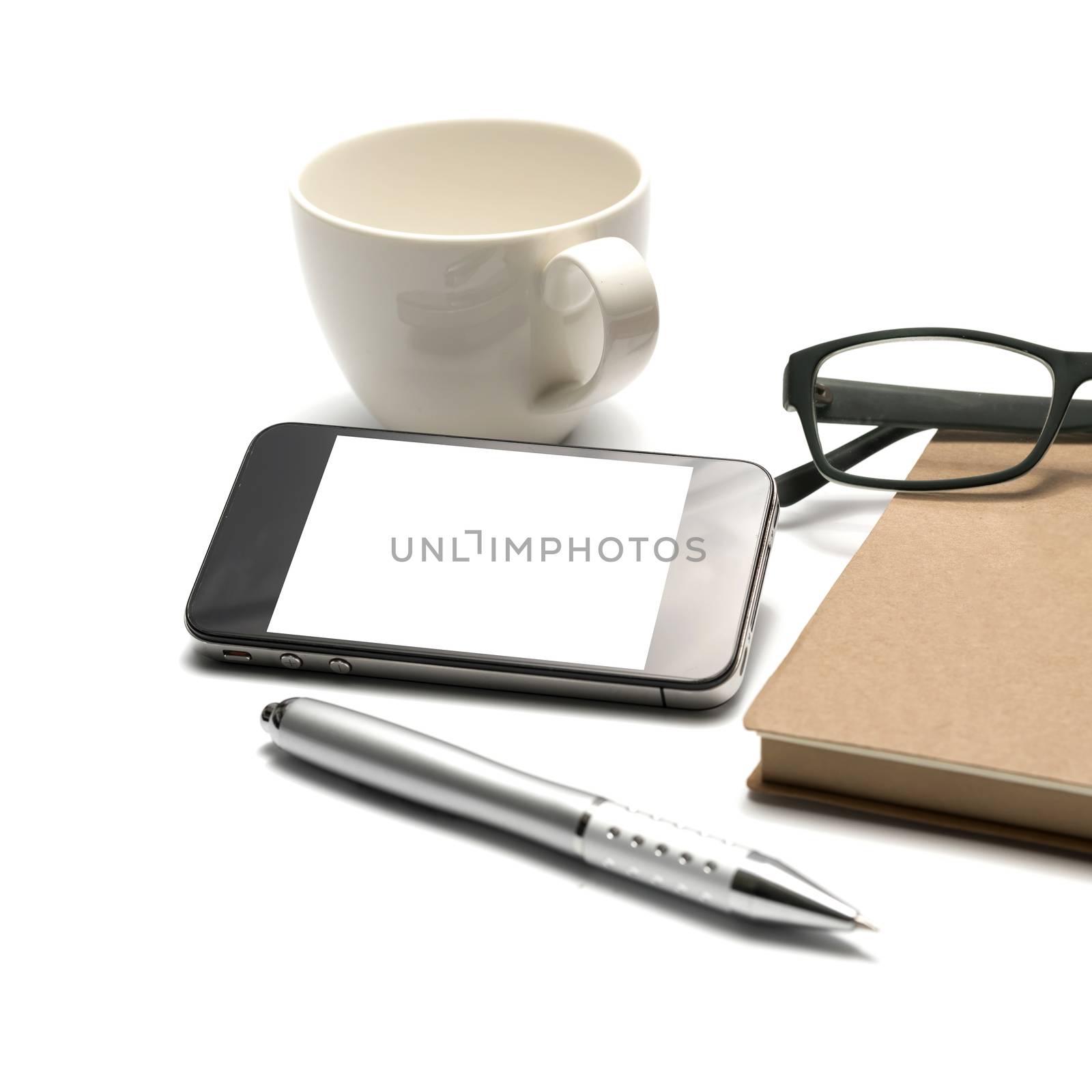 smart phone and eyeglasses with notebook and pen isolated on white background