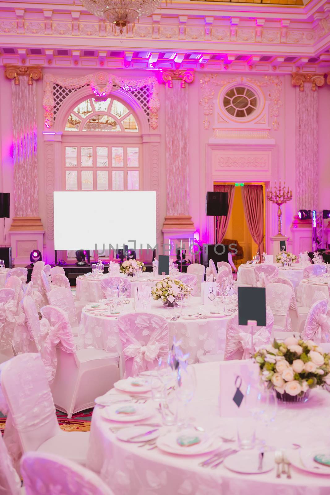 image of tables setting at wedding hall by sarymsakov