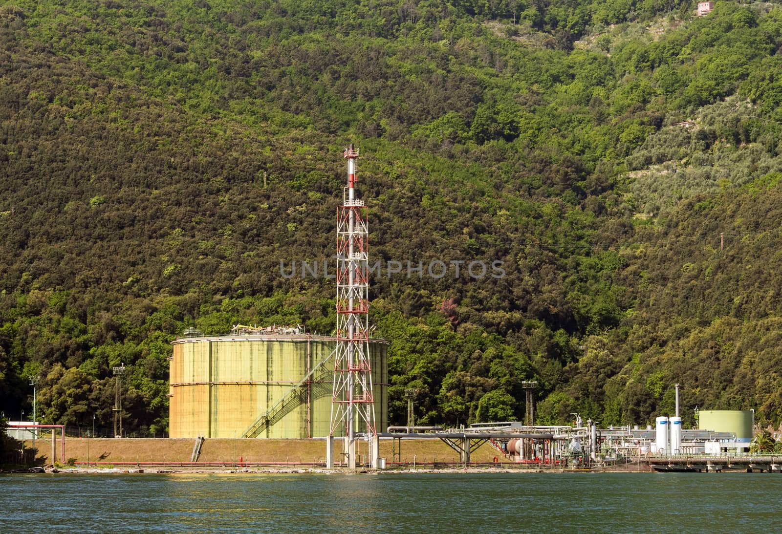 Gas and oil deposit in sea shore, with green environment