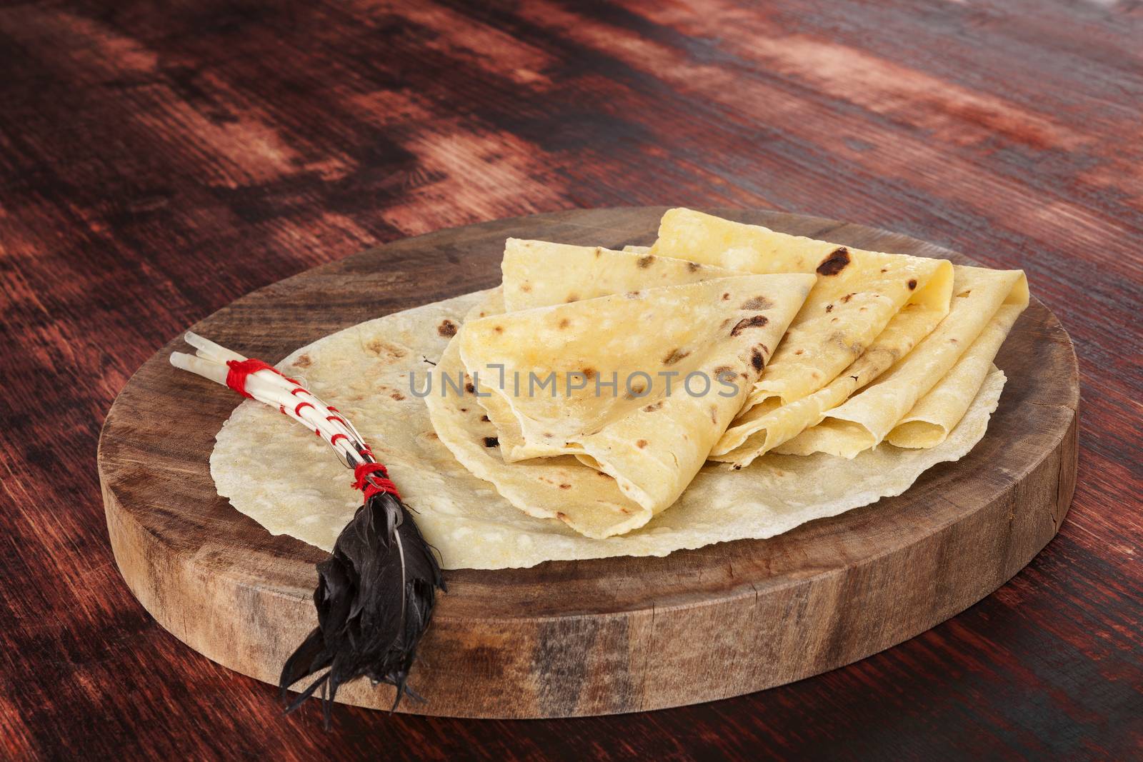 Pancakes on wooden vintage kitchen board.