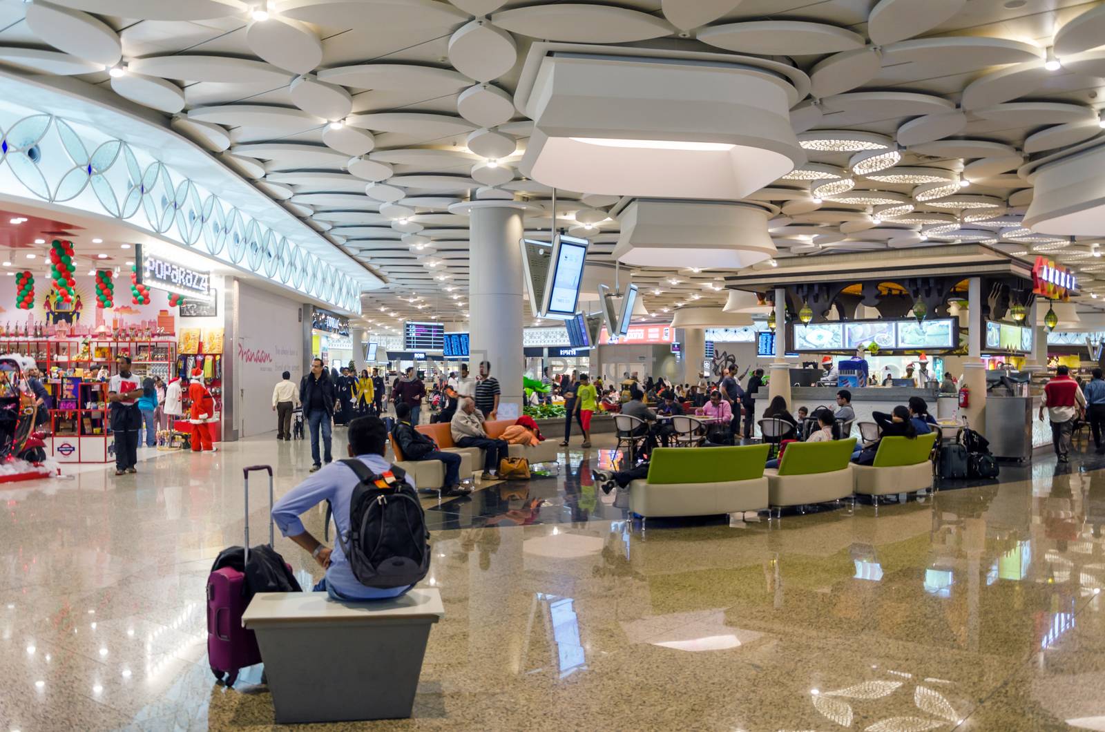 Mumbai, India - December25, 2014: Tourist Shopping at Duty free zone in Chhatrapati Shivaji International Airport by siraanamwong