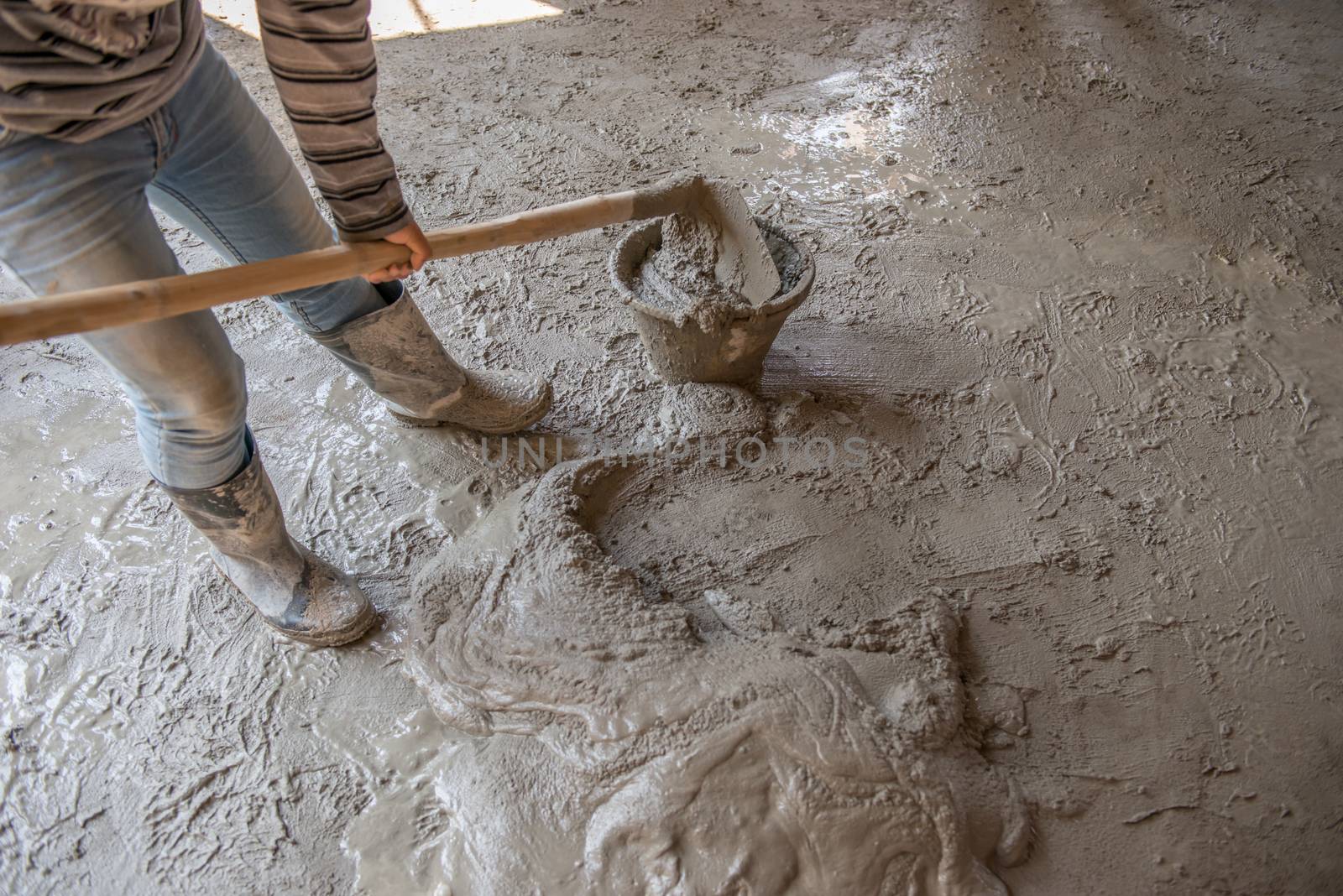 Worker is  mixing mortar prepare for plastering