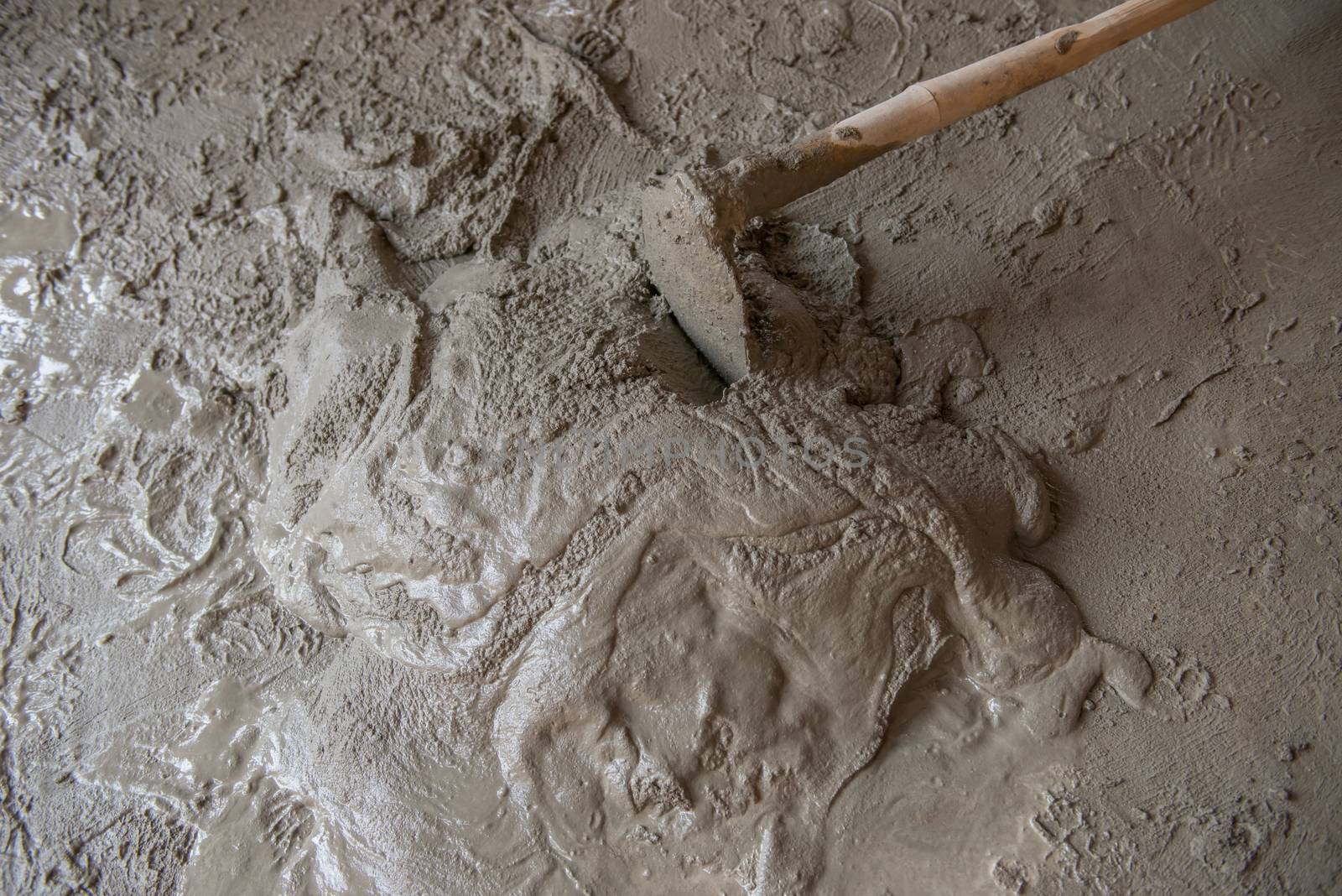 Worker is  mixing mortar prepare for plastering