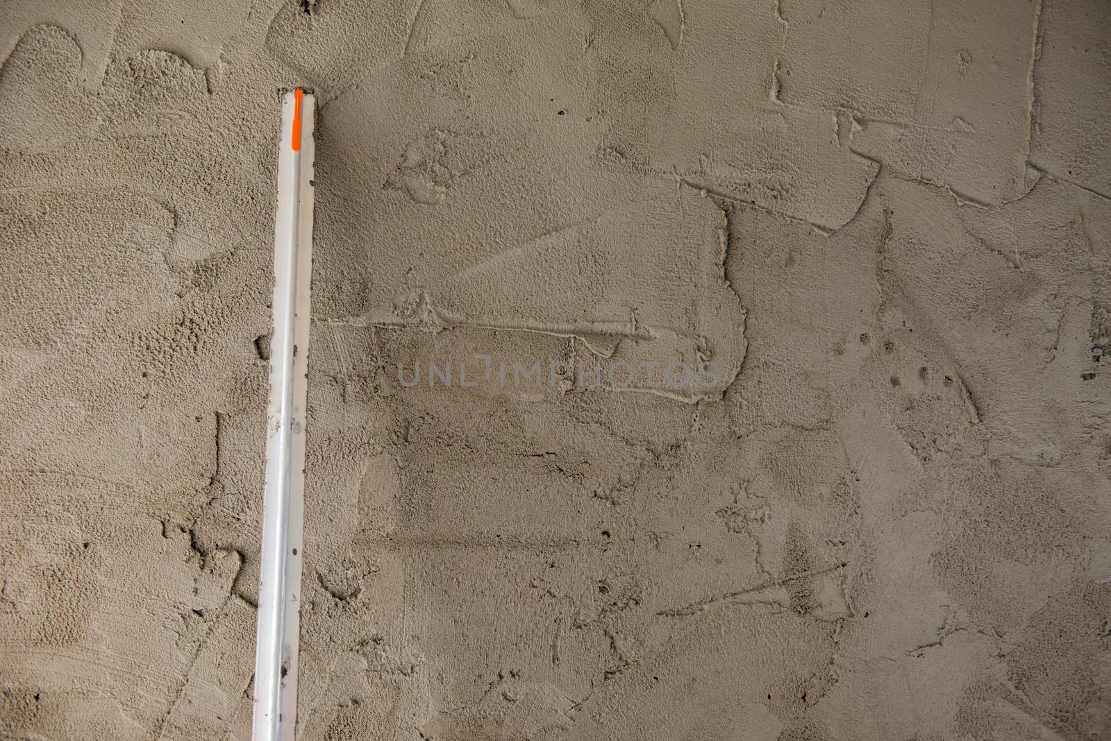 Masons are building walls plastered smooth.