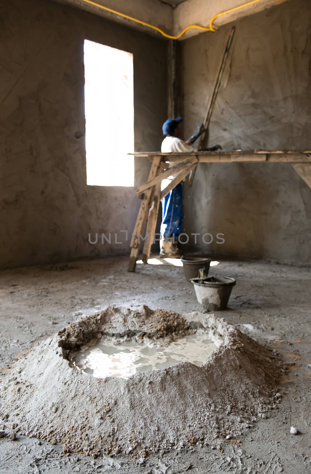 Masons are building walls plastered smooth.