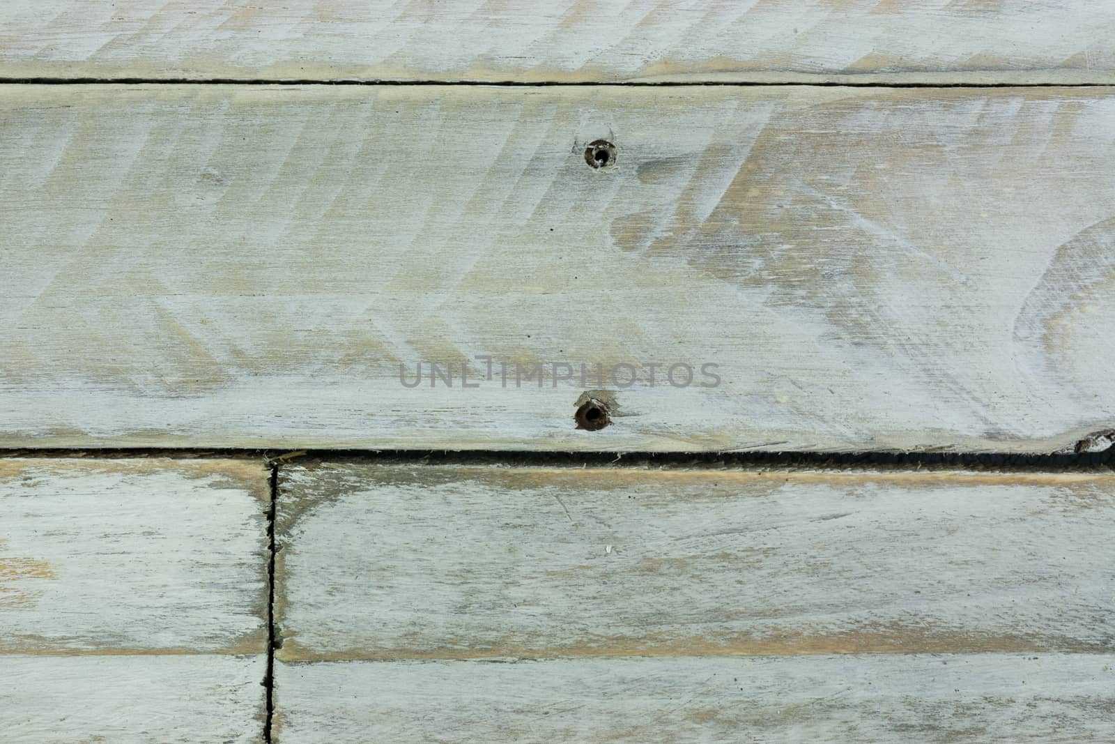 Old wooden planks painted white and distressed