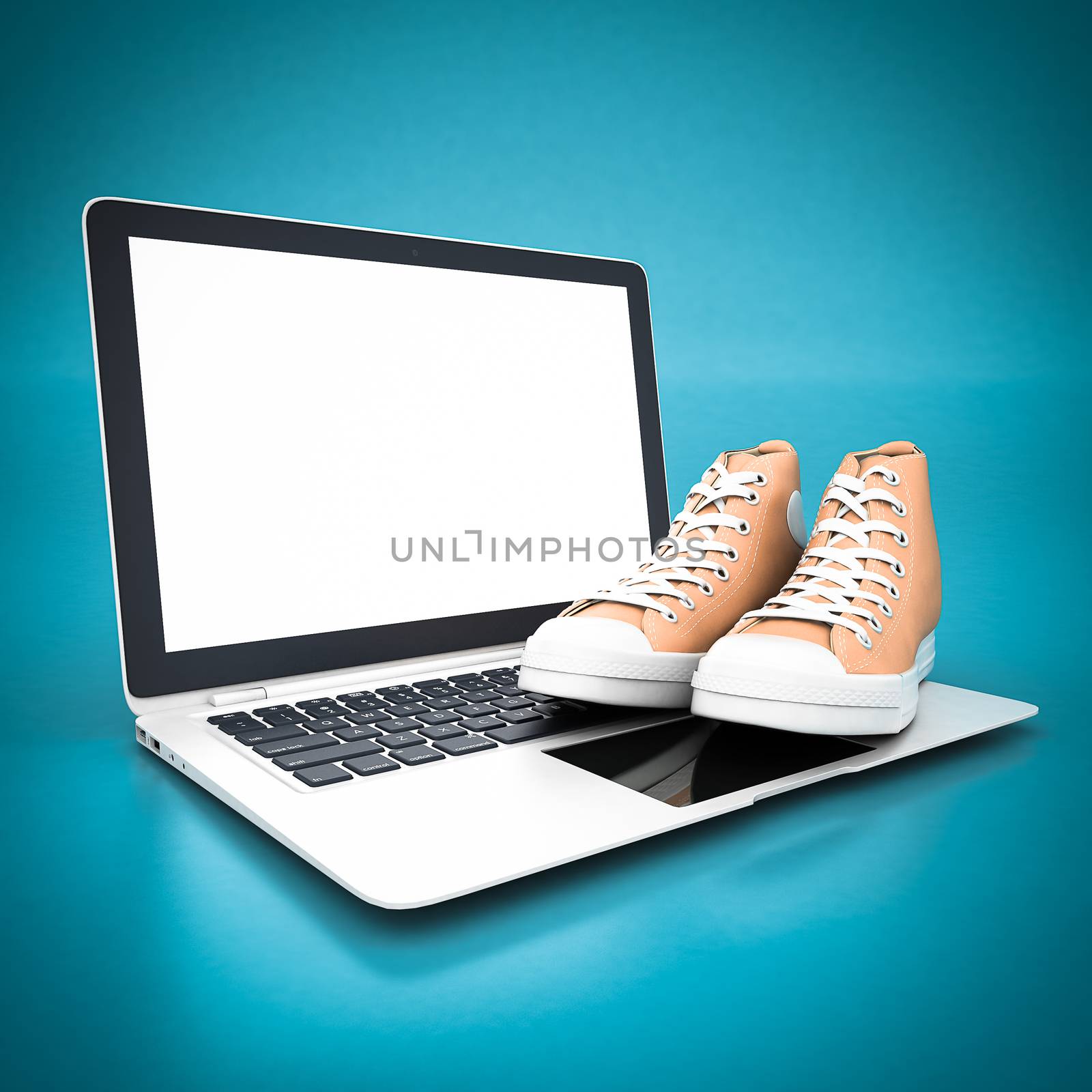 Fashion leather shoes and white laptop on a blue background