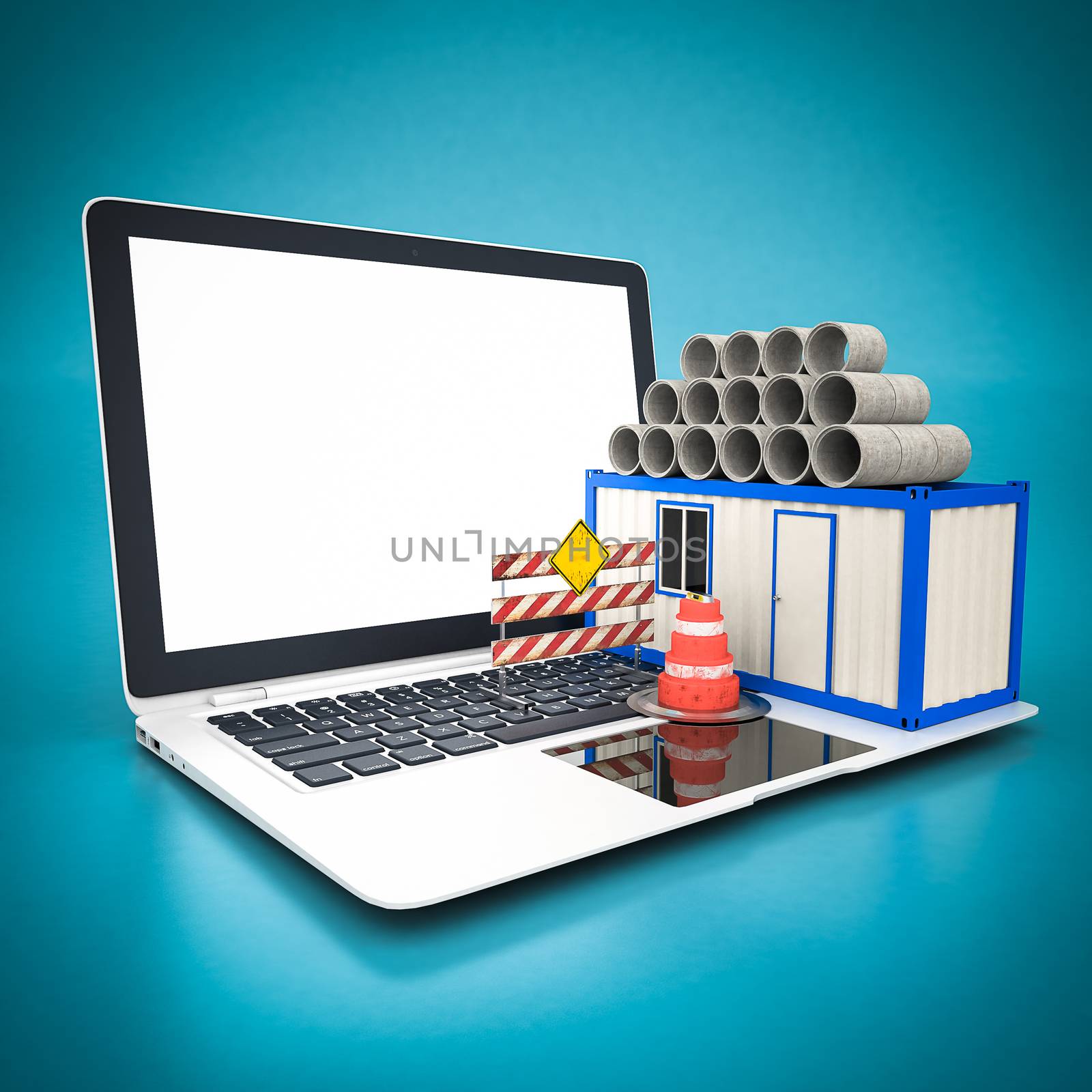 concrete pipes and white laptop on a blue background