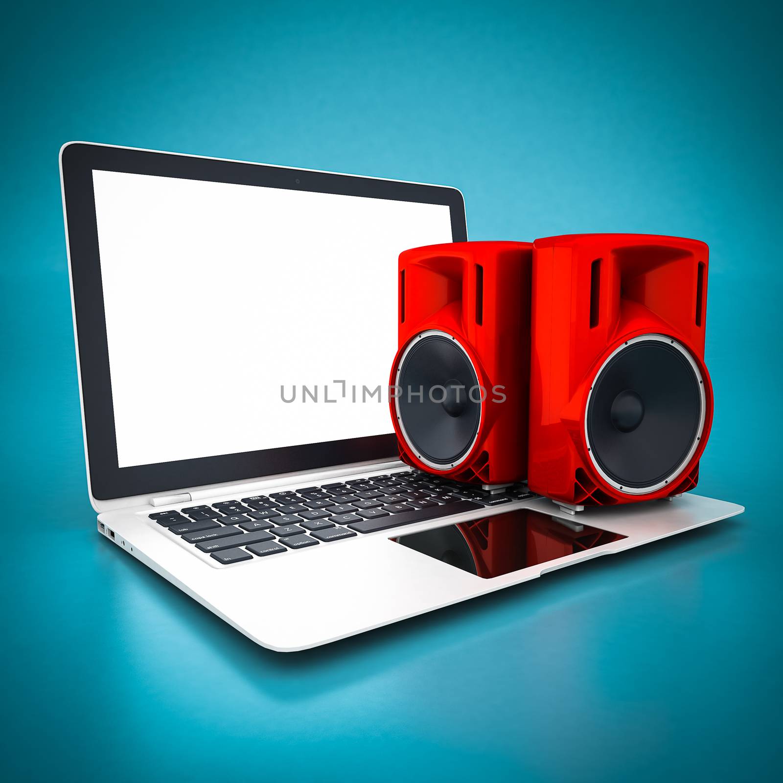music speaker and white laptop on a blue background