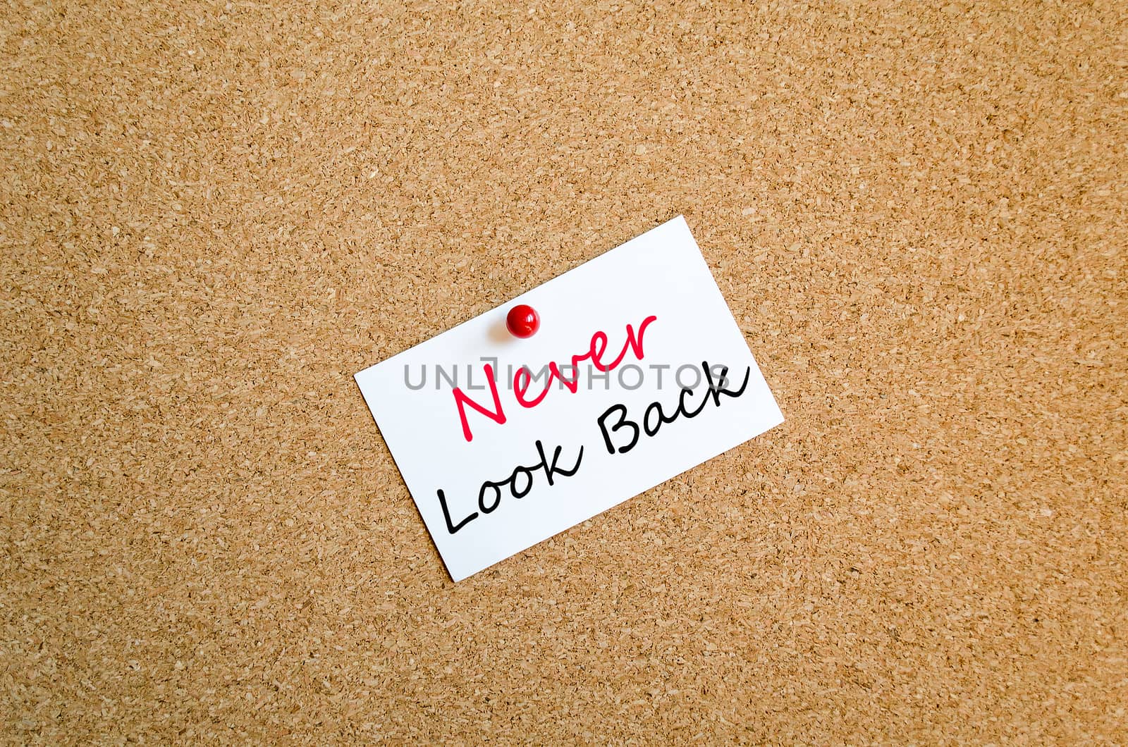 Sticky Note On Cork Board Background Never look back concept