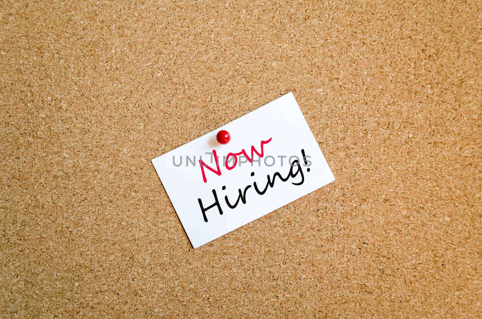Sticky Note On Cork Board Background Now Hiring concept