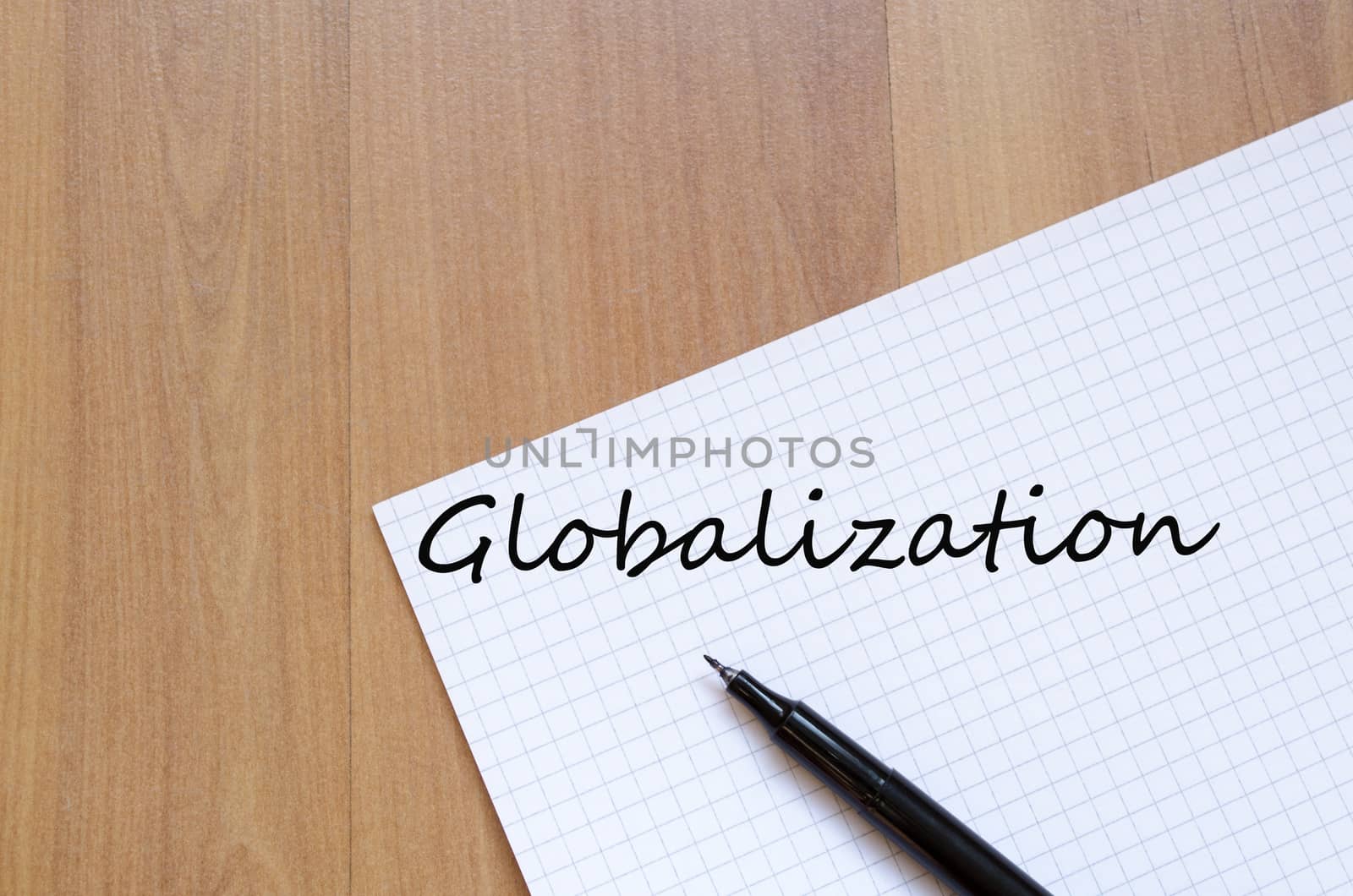 White blank notepad on office wooden table Globalization concept