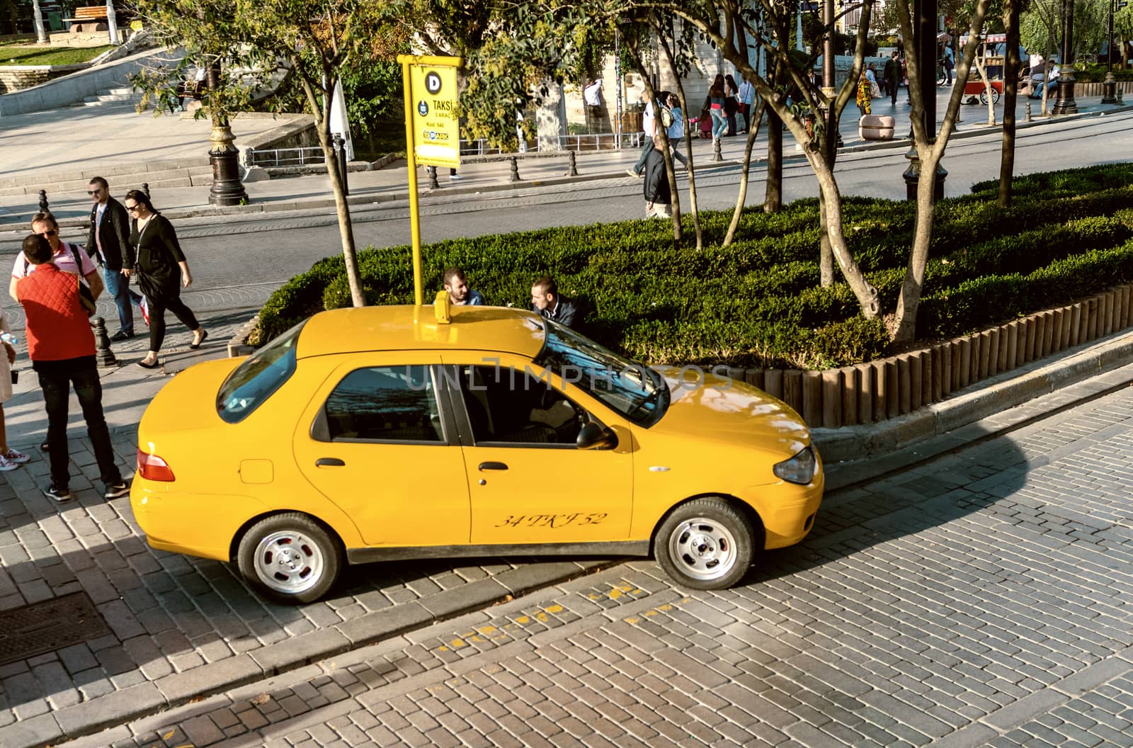 ISTANBUL - SEPTEMBER 21, 2014: Yellow taxis along city streets. by jovannig