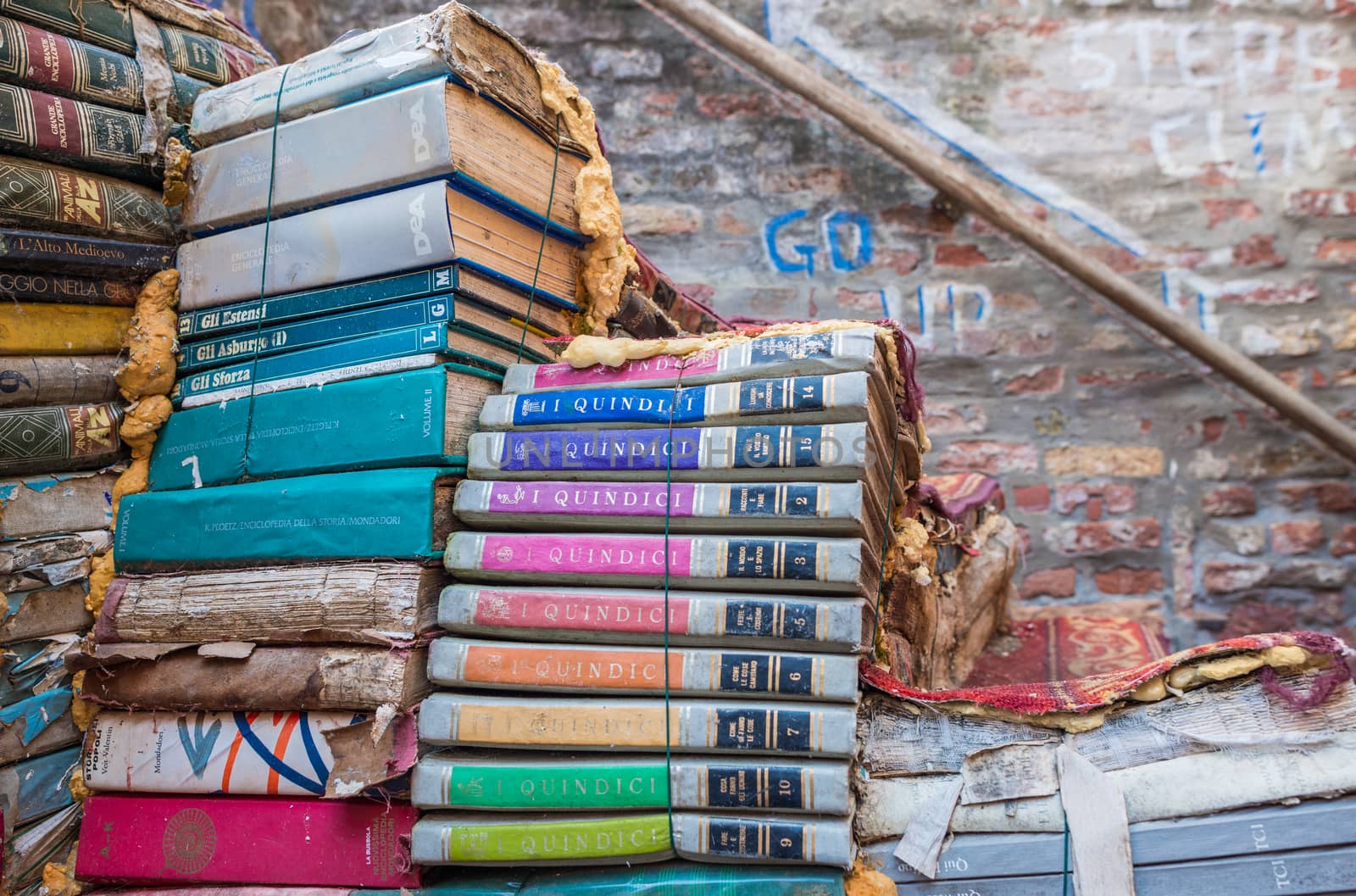 VENICE, ITALY - MAR 22, 2014: Old books of Acqua Alta bookstore. This is one of the most famous used bookstore in the world.