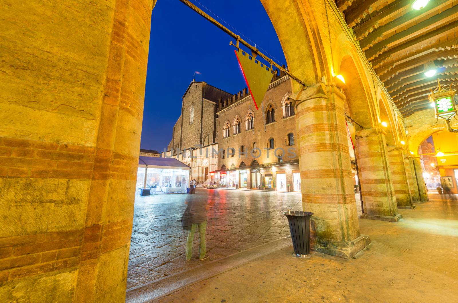 BOLOGNA - OCTOBER 21, 2014: Tourists in city center at night. Bologna is visited by more than 5 million people annually.