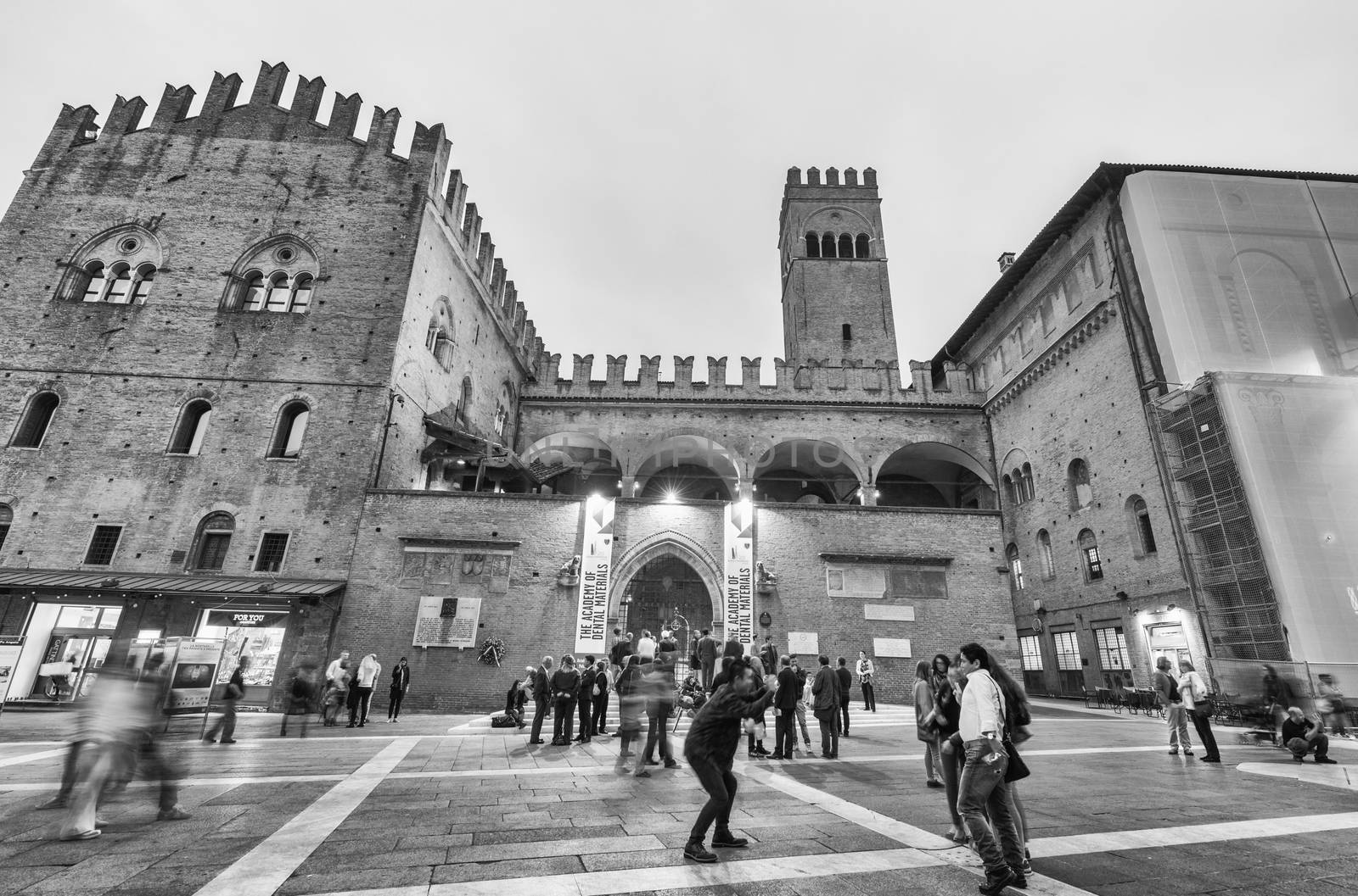 BOLOGNA - OCTOBER 21, 2014: Tourists in city center at night. Bologna is visited by more than 5 million people annually.