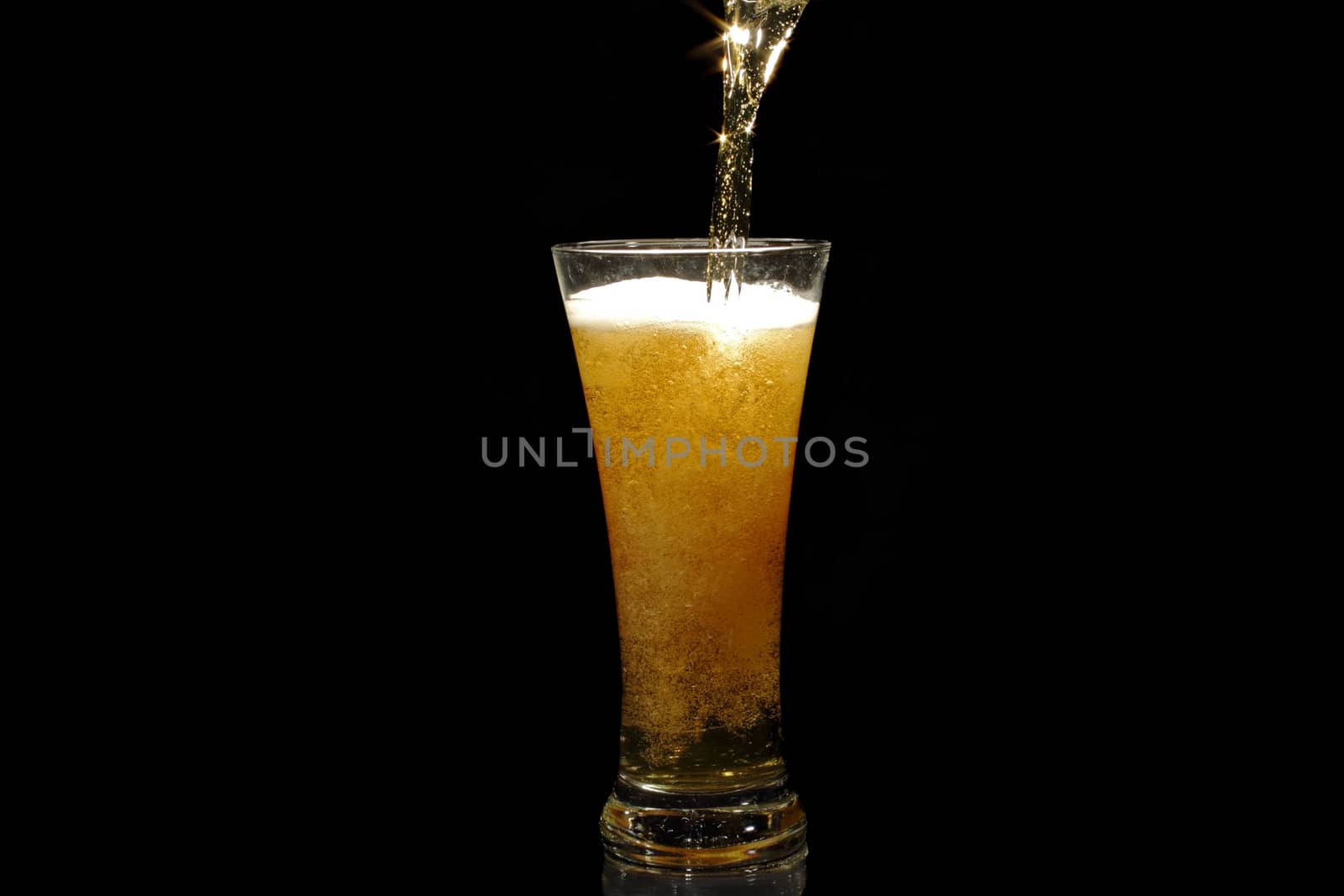 Beer pouring into a glass