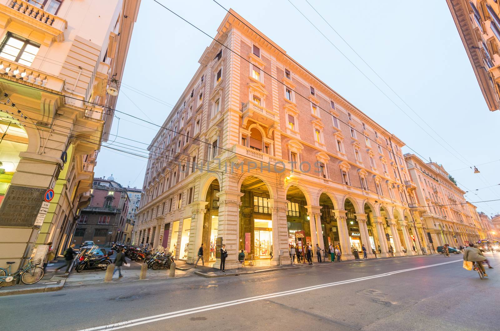 BOLOGNA - OCTOBER 21, 2014: Tourists in city center at night. Bologna is visited by more than 5 million people annually.