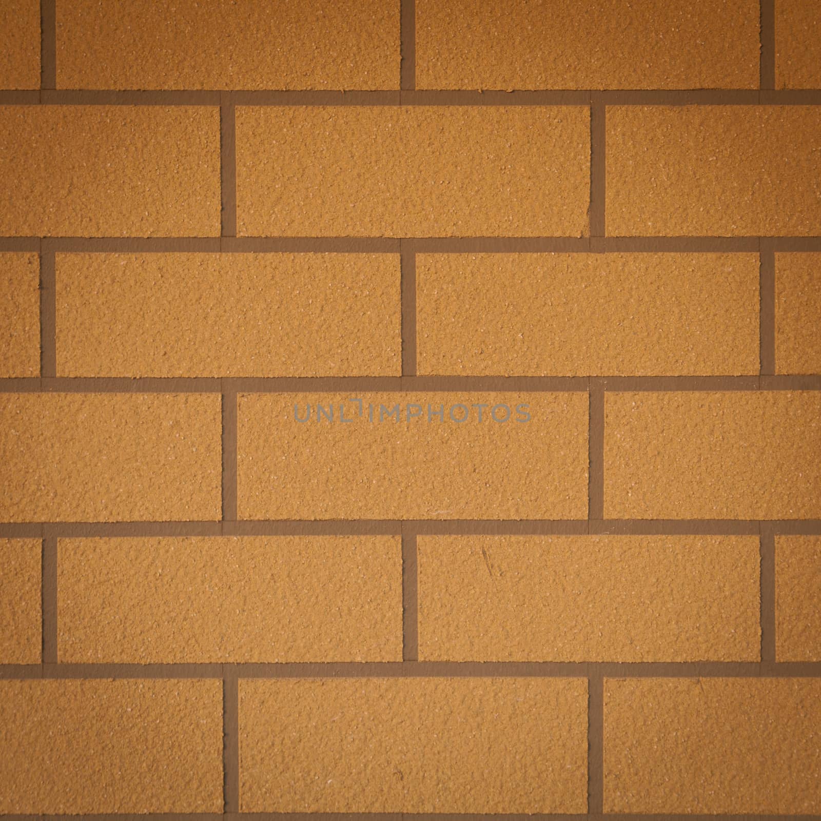 Brown brick wall. A square brick tile wall.