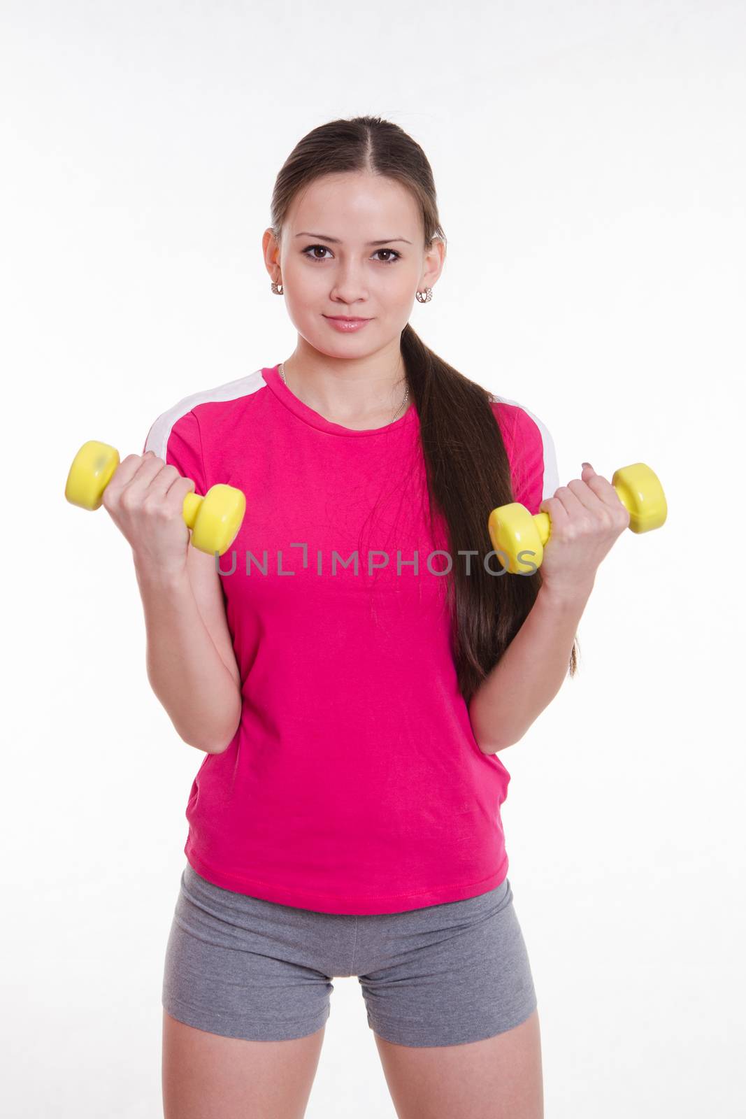 Young beautiful girl holds Europeans physical exercise