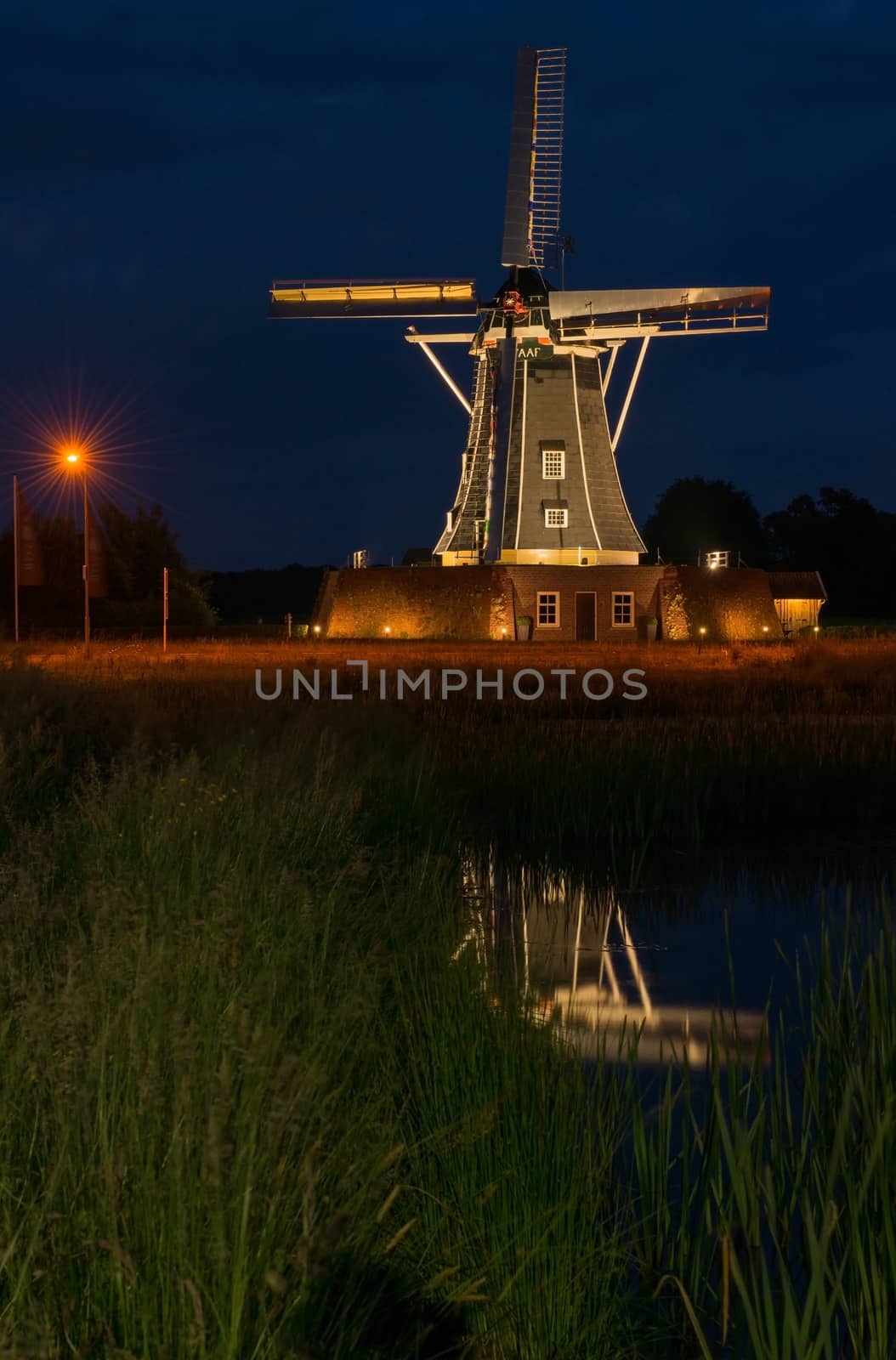 Authentic renovated windmill in Winterswijk in the east of the Netherlands in special illumination