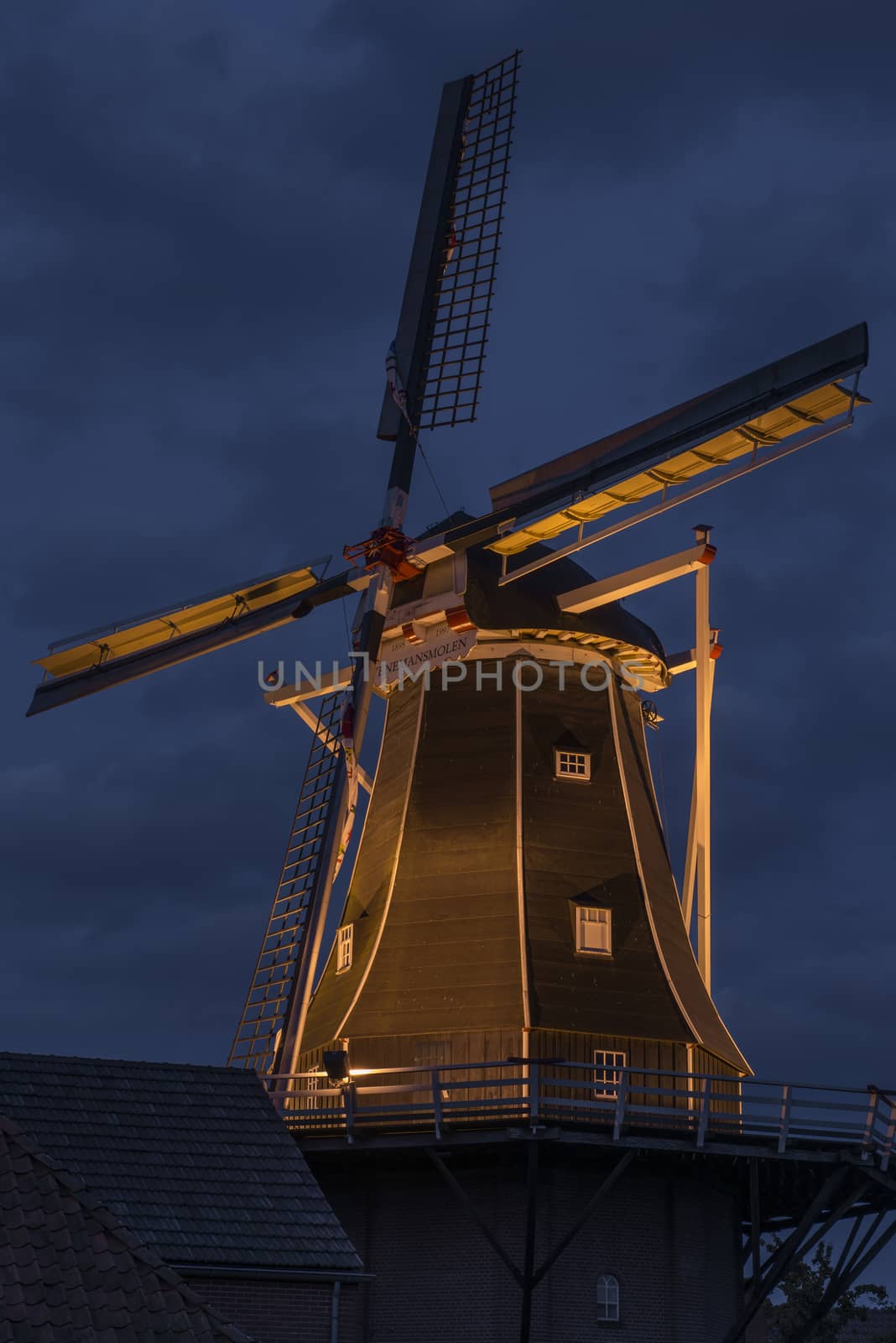 Authentic renovated windmill in Winterswijk in the east of the Netherlands in special illumination during in the beginning of the evening.