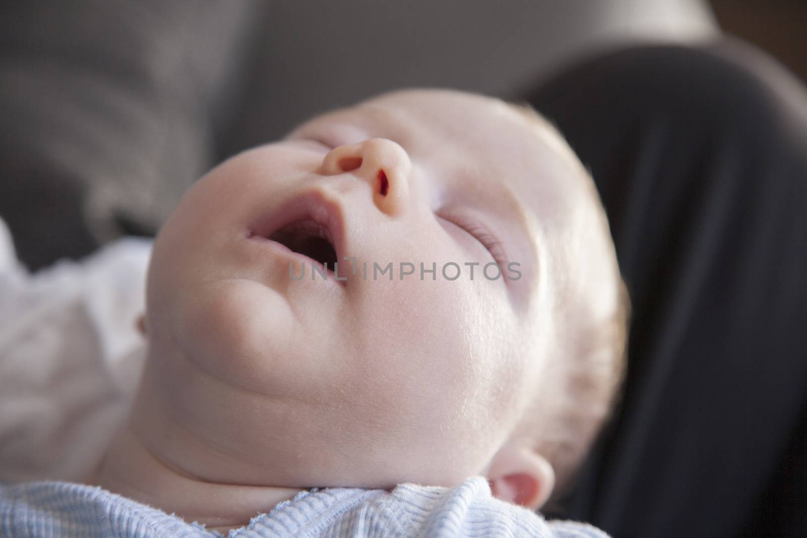 one month age newborn baby face closed eyes open mouth sleeping dreaming
