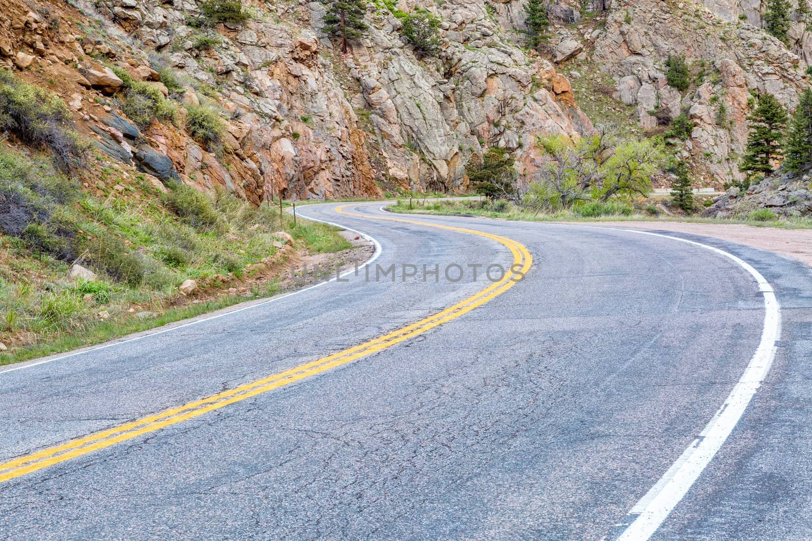 windy, mountain Road through canyon by PixelsAway