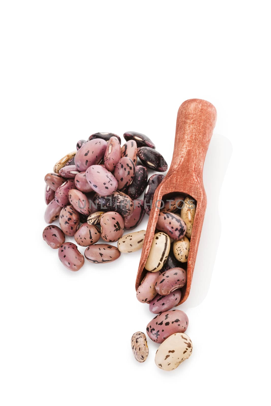 Beans on wooden spoon isolated on white background. Healthy legume eating. 