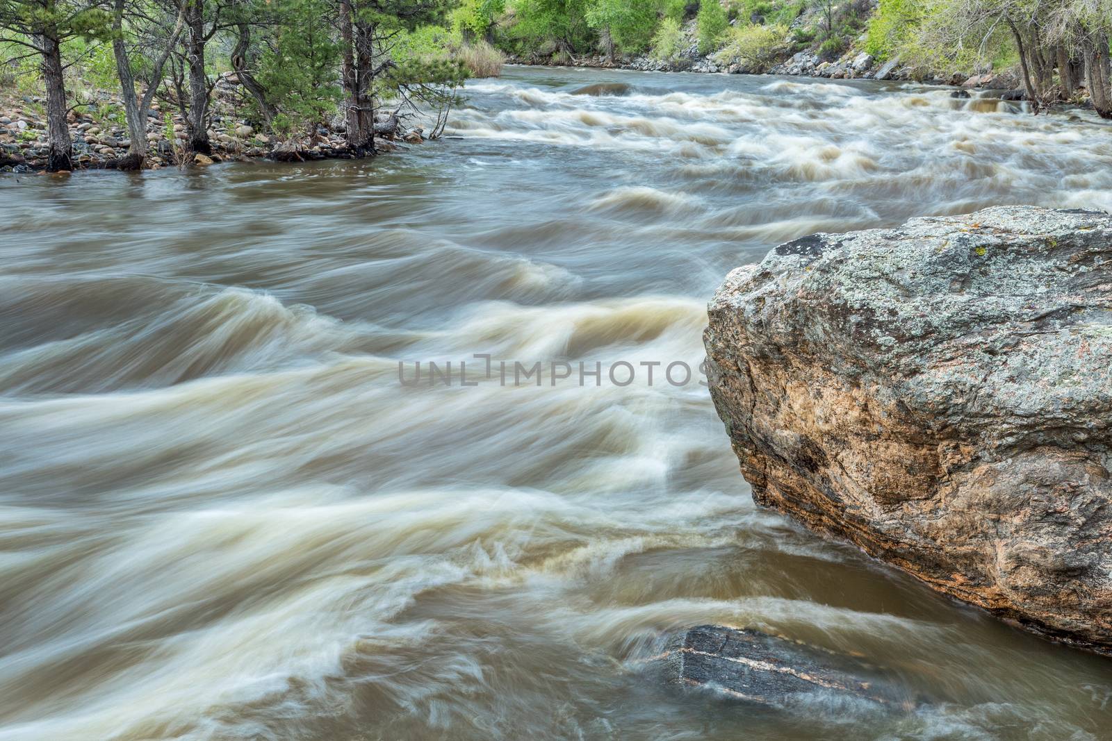 Poudre River at spring run off by PixelsAway