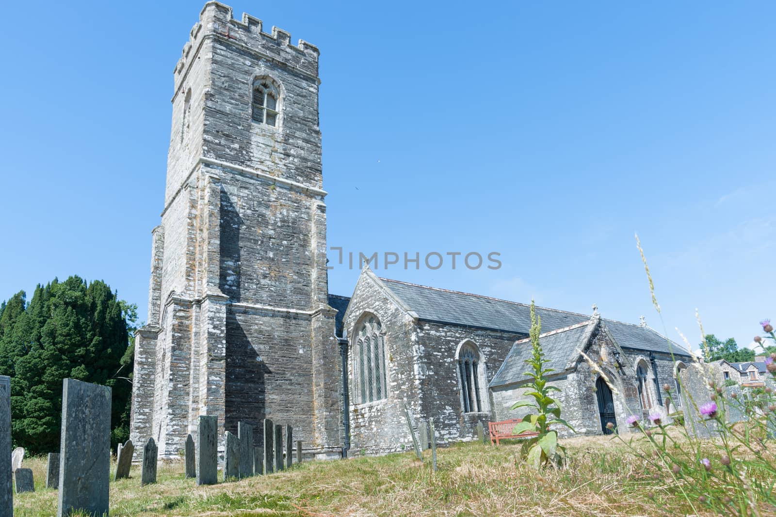 Historic English stone church in Cornish countryside.