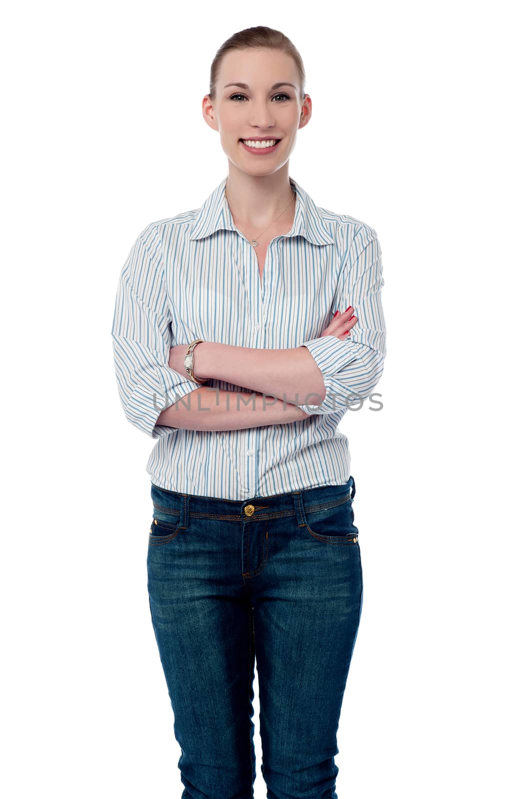 Successful woman with folded arms by stockyimages