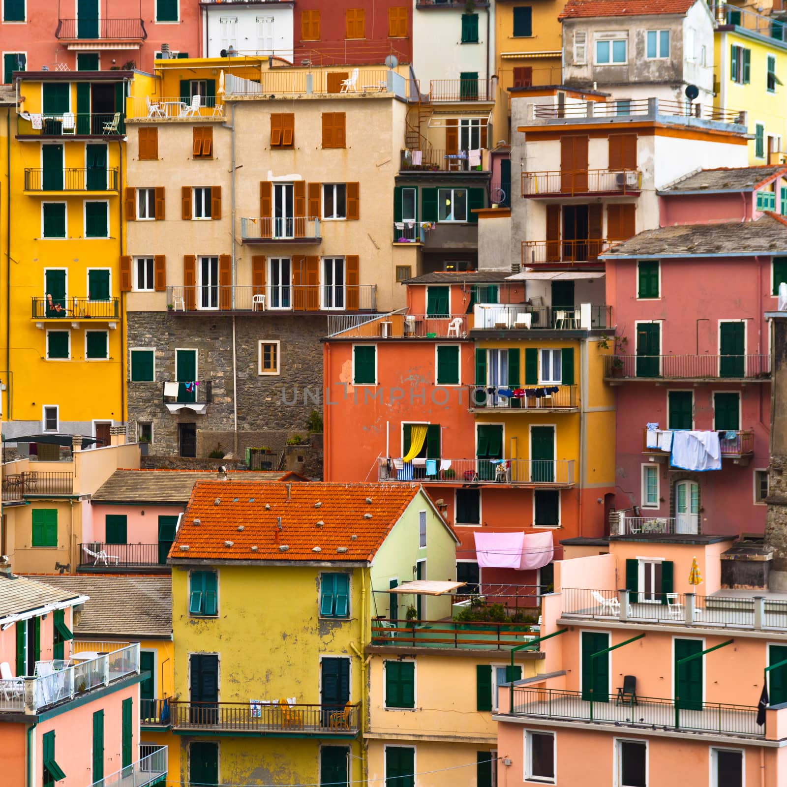 Colourful house frontings forming a beautiful background pattern. Manarola village, Cinque Terre, Italy. Square composition.